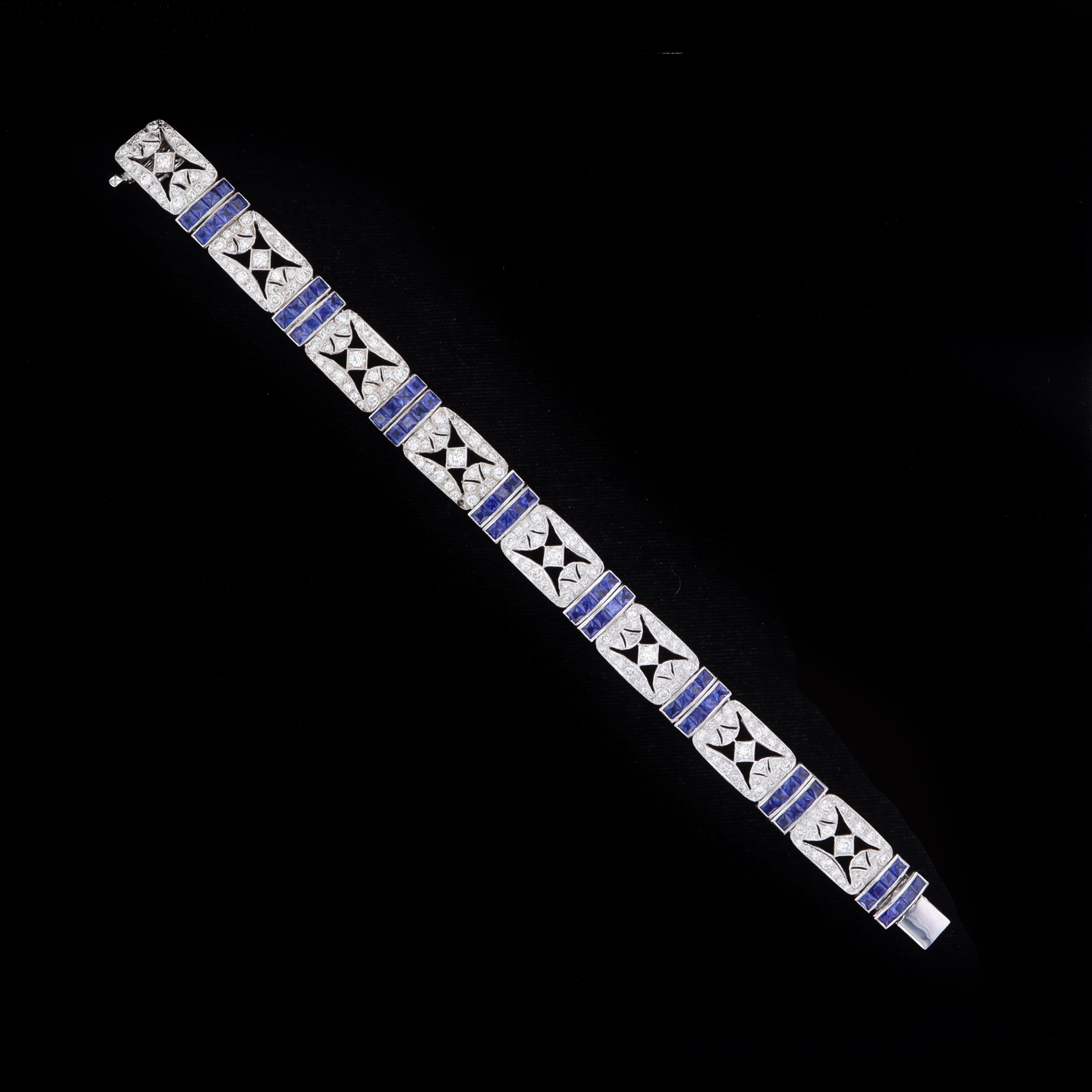 Celebrate an era filled with opulence, style and luxury materials wearing this estate Art Deco diamond and sapphire bracelet. This shimmering bracelet is set with sparkling round cut diamonds that weigh approximately 4.59ct. The color of these