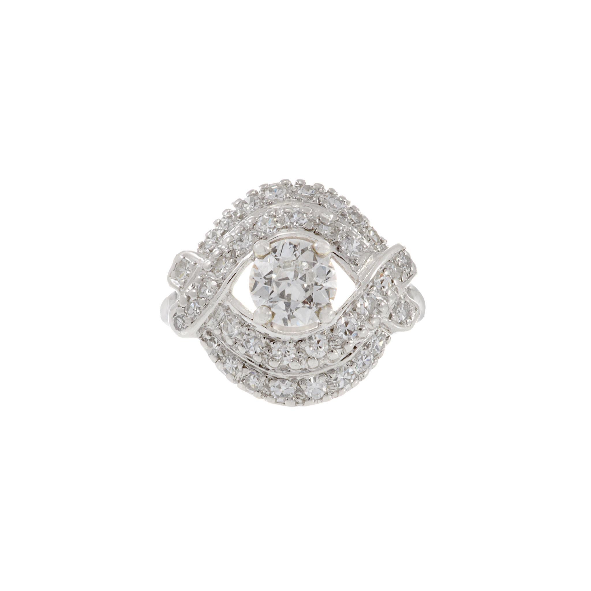 Indulge in the timeless allure of our Estate Art Deco Platinum and Diamond Ring. Centered with one old European cut diamond weighing 0.83ct (G-VS2), this exquisite piece is surrounded by 0.78ct-tw round-cut diamonds. Crafted in platinum, this ring