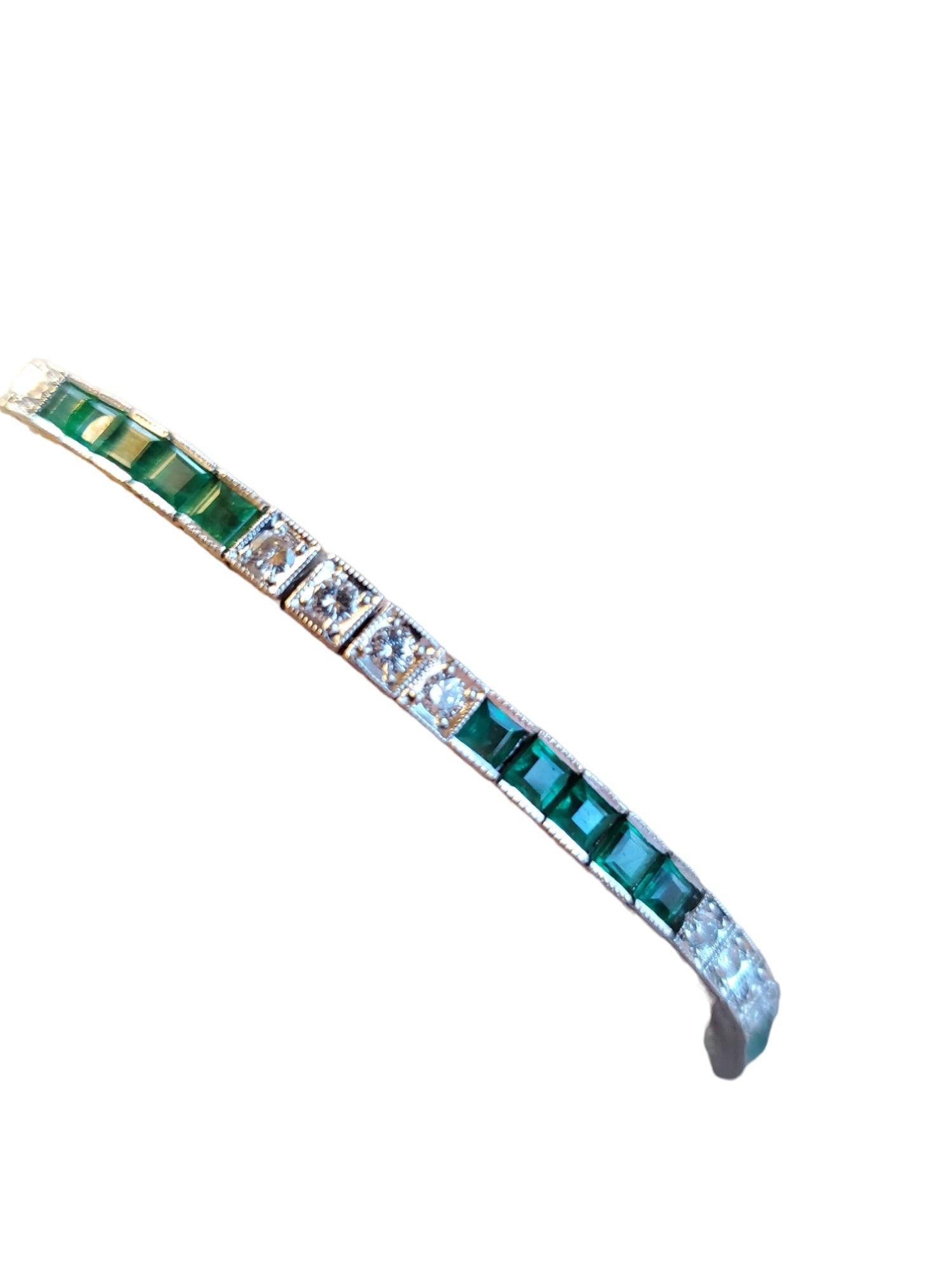 Listed is a midcentury made Art Deco style Platinum Diamond and natural emerald bracelet. There are approximately .96 carats colorless to near colorless F-H color VS round brilliant diamonds and green natural emeralds. The bracelet is heavy platinum