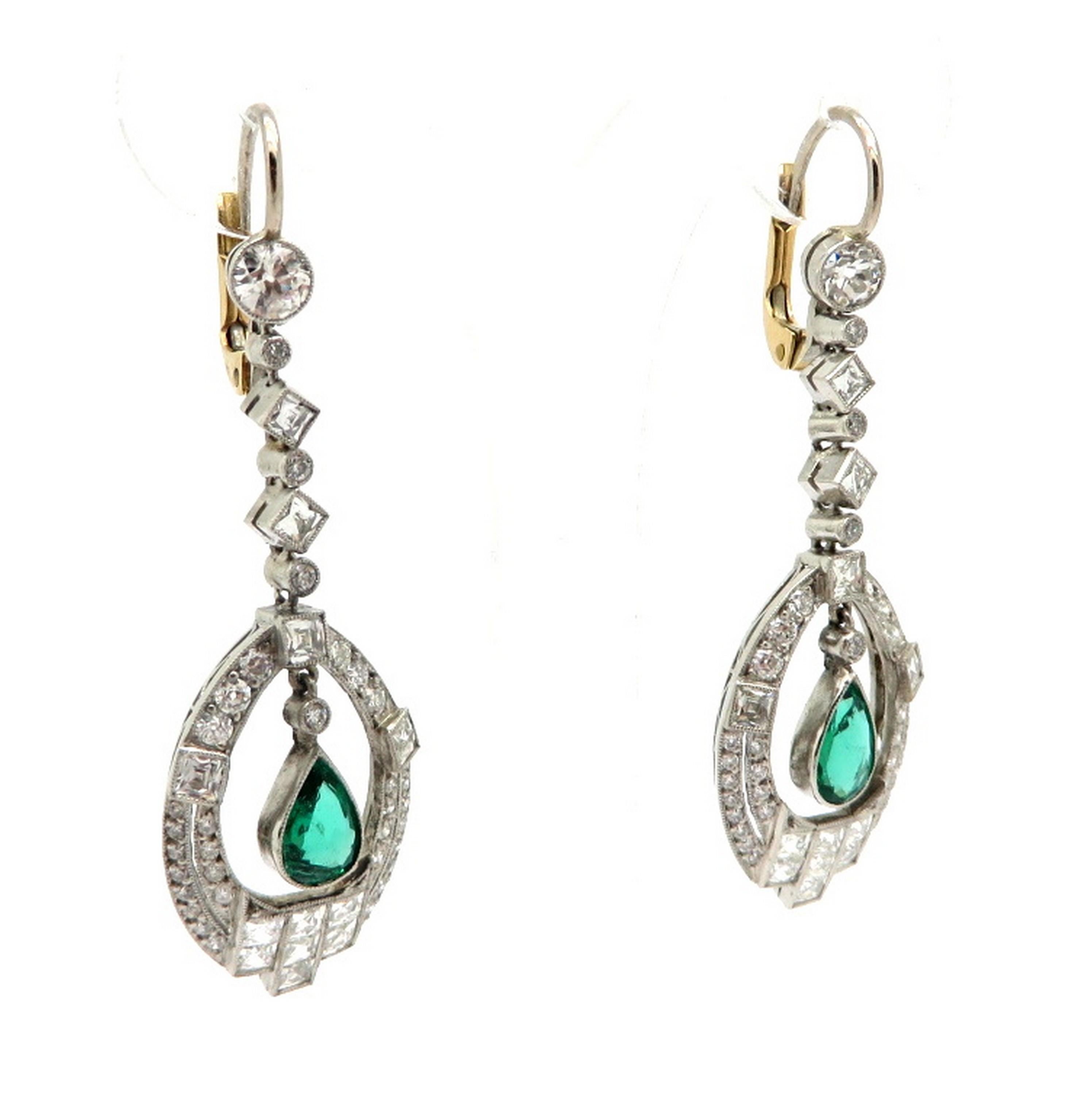 Estate Art Deco style platinum and 14K diamond and emerald dangle earrings. Showcasing 118 French cut and Old European cut diamonds, bead and bezel set, with various measurements, weighing a combined total of 2.26 carats. Diamond grading: color