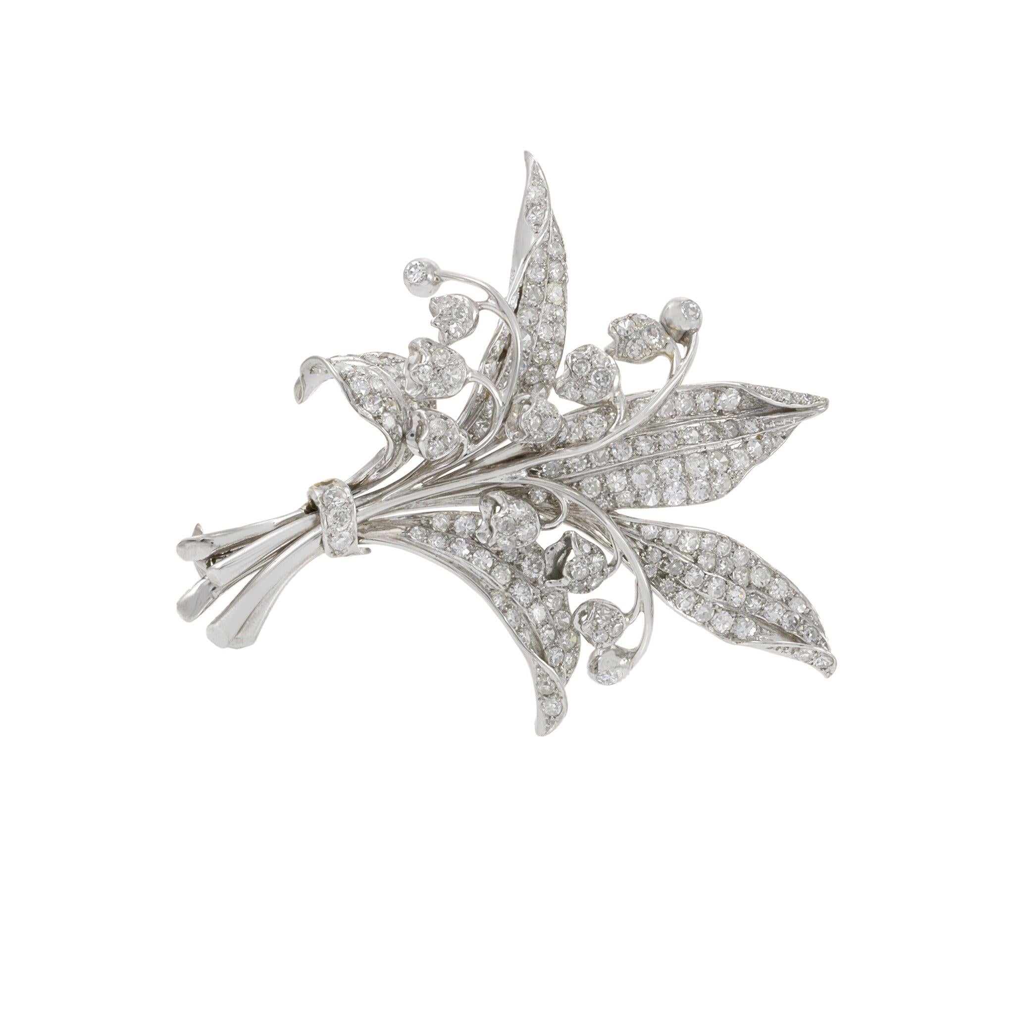 Indulge in luxury with our Estate Art Nouveau Platinum Flower Pin adorned with 6.76 carats of G-color and VS1 clarity, round-cut diamonds. Meticulously crafted, this elegant piece showcases the finest materials and expertly selected diamonds,