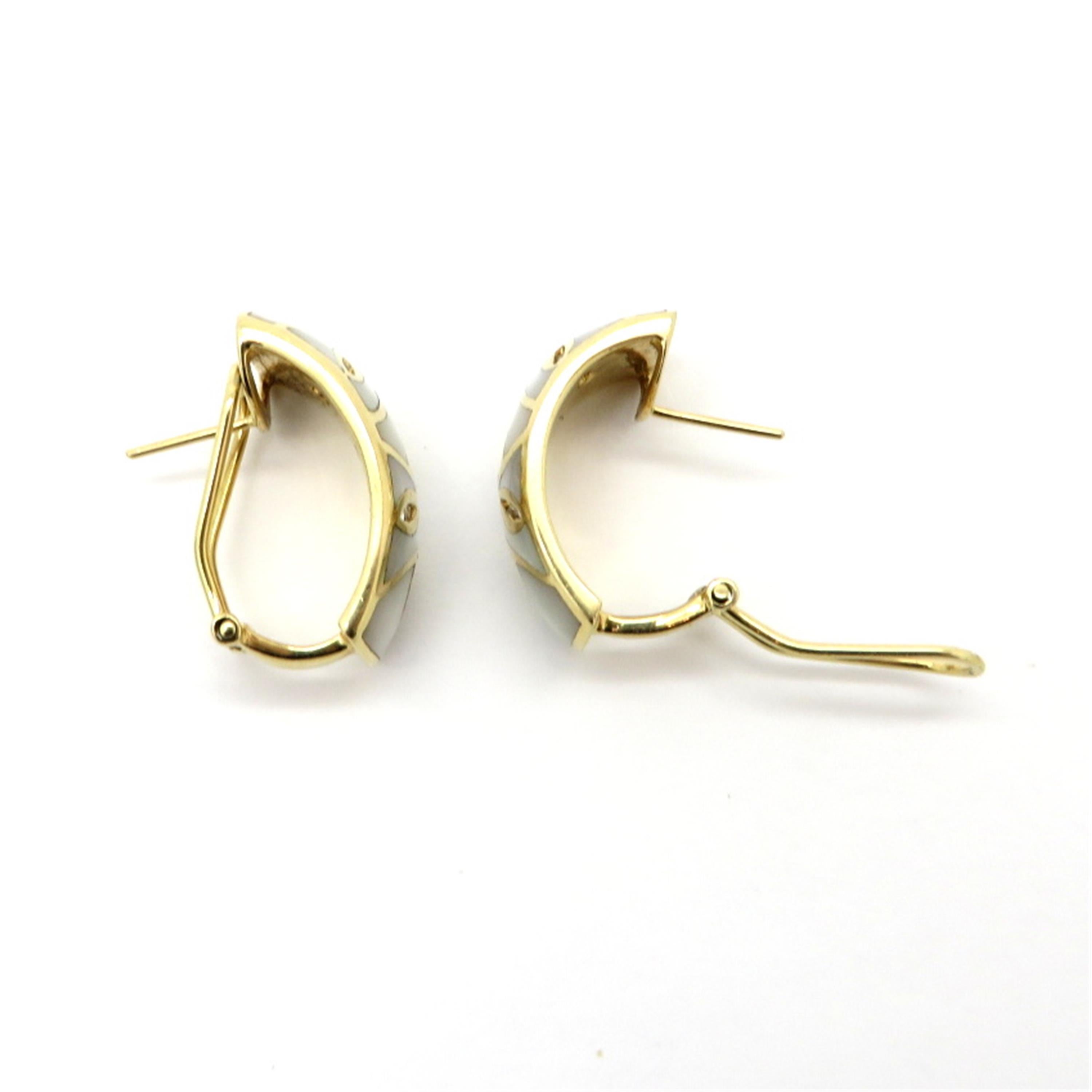 Estate Asher collection 14K yellow gold round diamond and mother-of-pearl inlay hoop earrings. Interspersed with 16 round brilliant cut diamonds weighing approximately 0.16 carats, having H color grade and SI1 – SI2 clarity grade. The earrings are