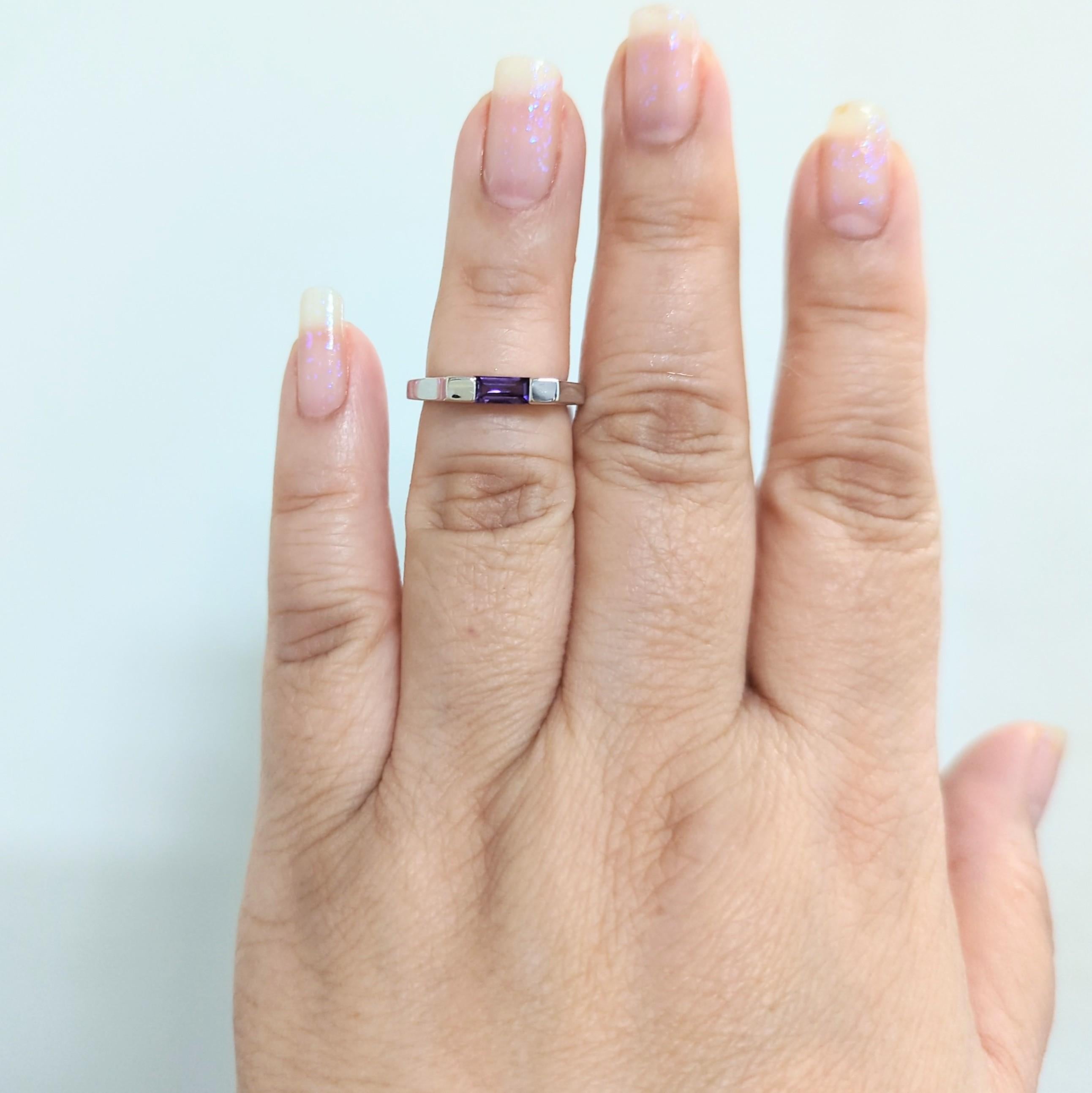 Estate Asprey 0.05 ct. amethyst baguette in a handmade 18k white gold mounting.  Ring size 6.25.