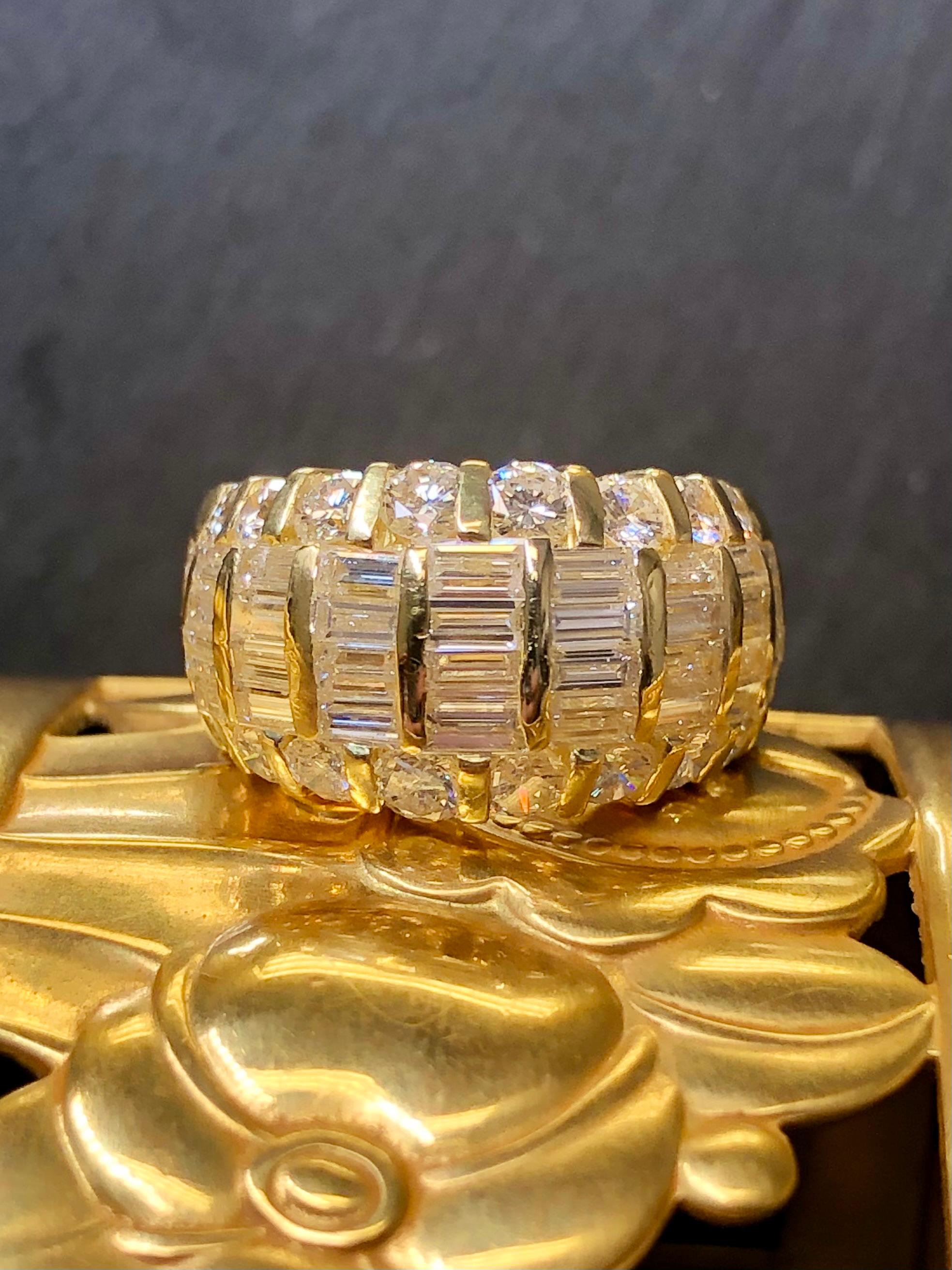 
A stunner of a cocktail ring done in 18K yellow gold set with gorgeously clean and white straight baguette and round diamonds ranging G-I in color and Vs1-2 in clarity with a total weight of 3.17cttw (stamped inside shank). As you can see, this