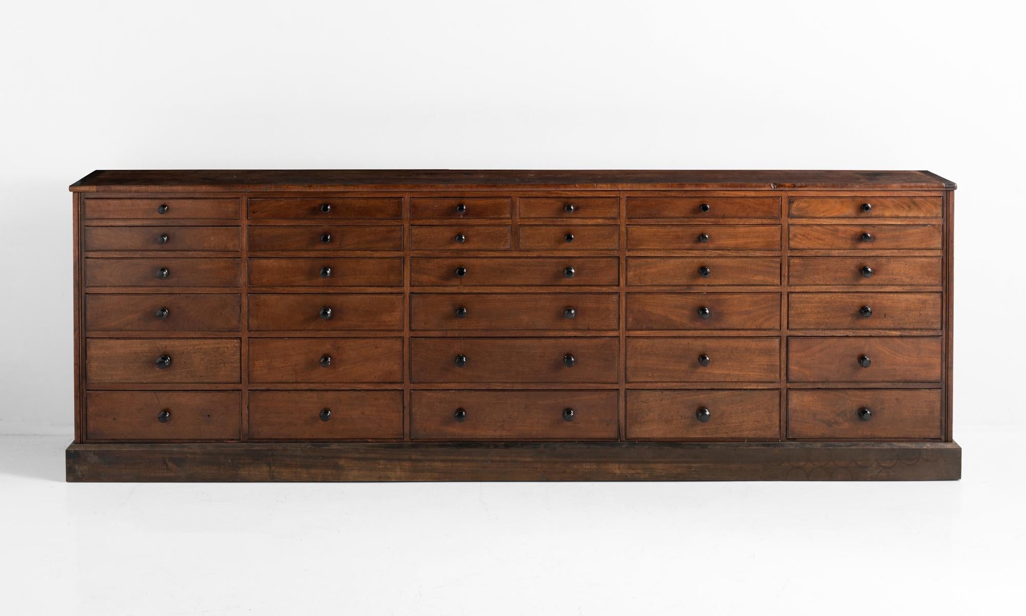 Mahogany drawers with ebonized turned handles. Originally from a cabinetmaker named “Boarders of Scotland” and dated 1843.
