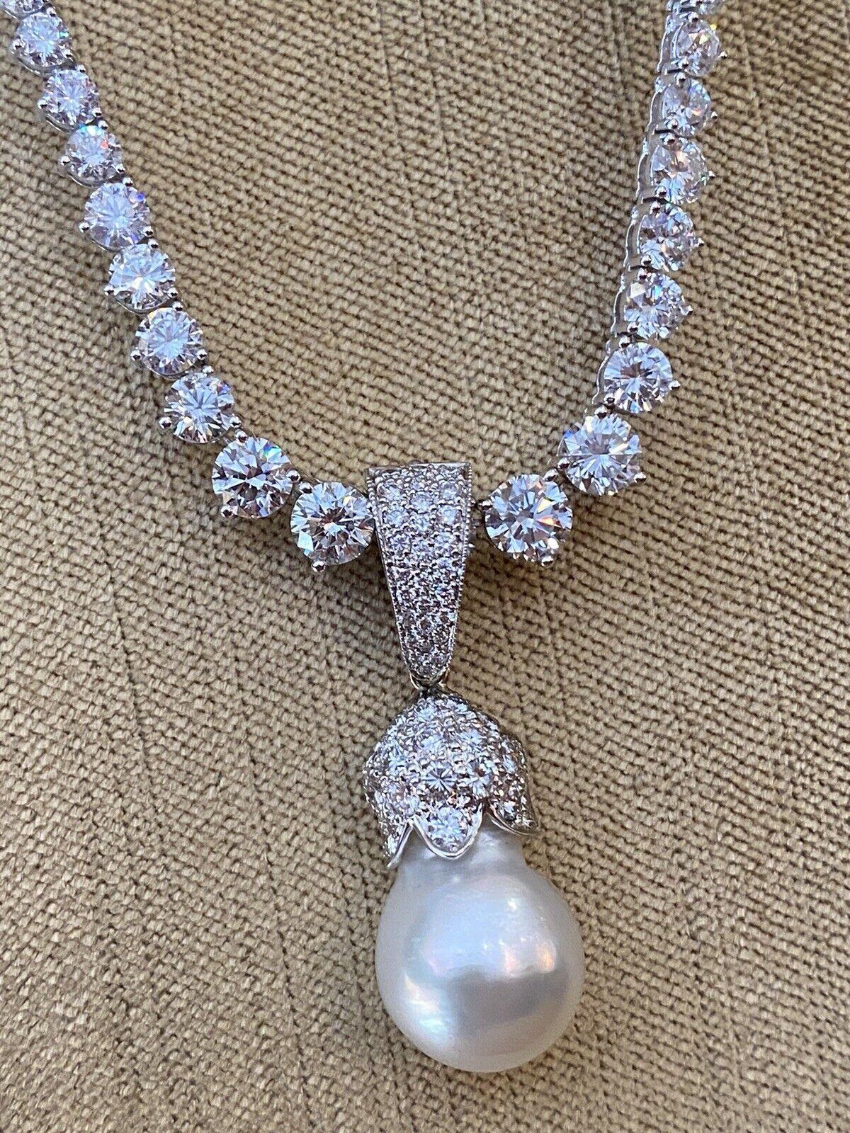 Estate Pearl & Diamond Pendant in 18k White Gold

Estate Pearl & Diamond Pendant features a 14.4mm white Baroque Pearl with a light pink overtone and high luster set in a tulip flower shaped pavè diamond cap attached to large diamond bail, all set