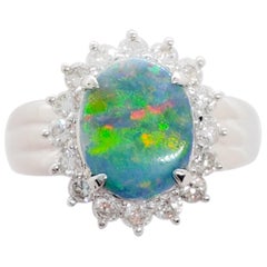 Estate Black Opal Oval and White Diamond Round Cocktail Ring in Platinum