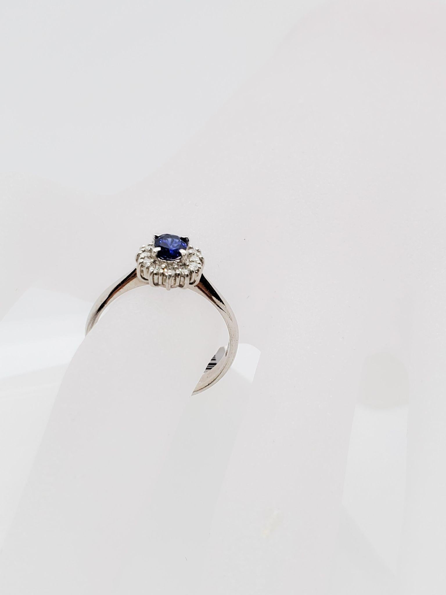 Oval Cut Estate Blue Sapphire Oval and Diamond Ring in Platinum