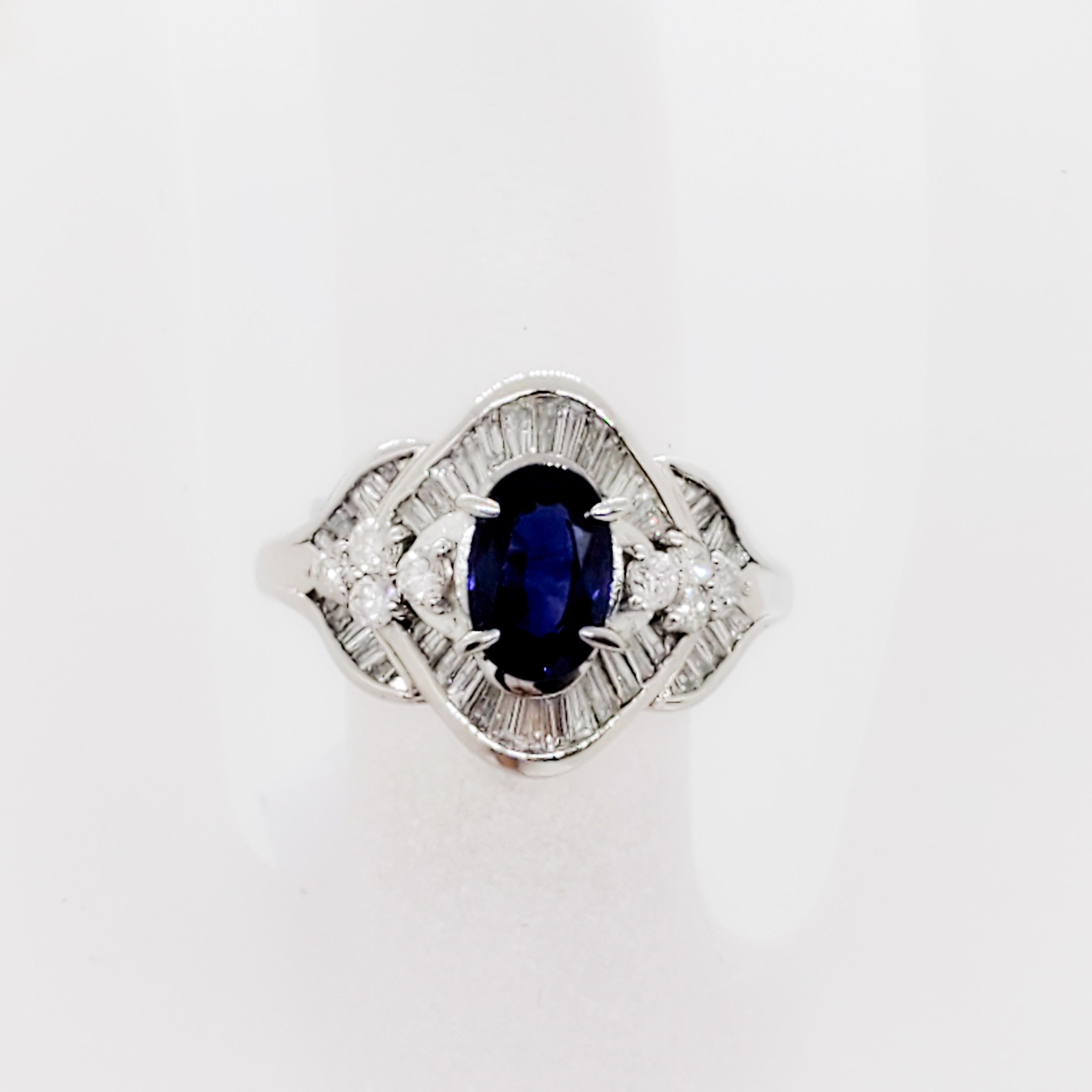 Oval Cut Estate Blue Sapphire Oval and White Diamond Cocktail Ring in Platinum