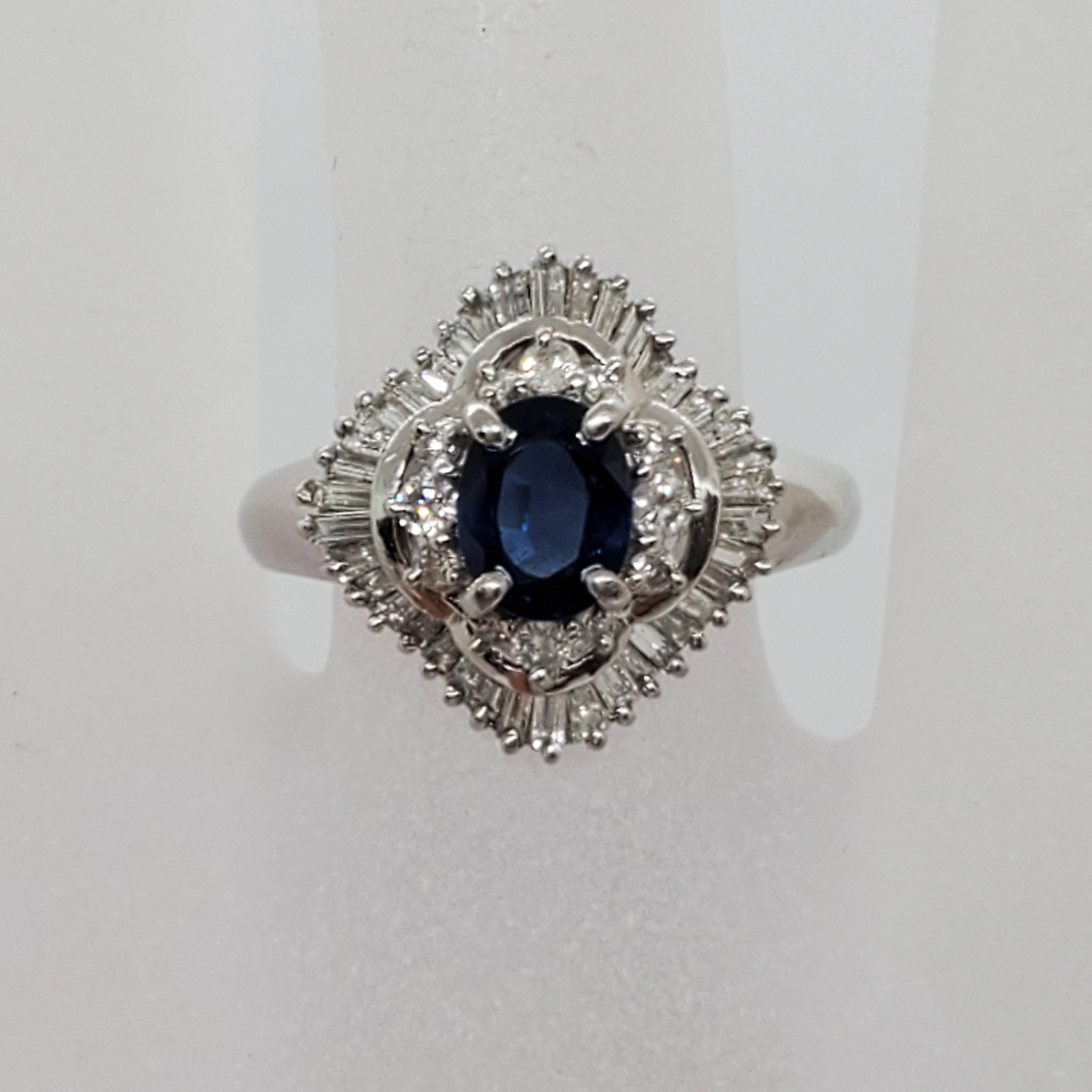 Oval Cut Estate Blue Sapphire Oval and White Diamond Cocktail Ring in Platinum