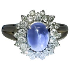 Estate Blue Star Sapphire Oval Cabochon and White Diamond Ring in Platinum