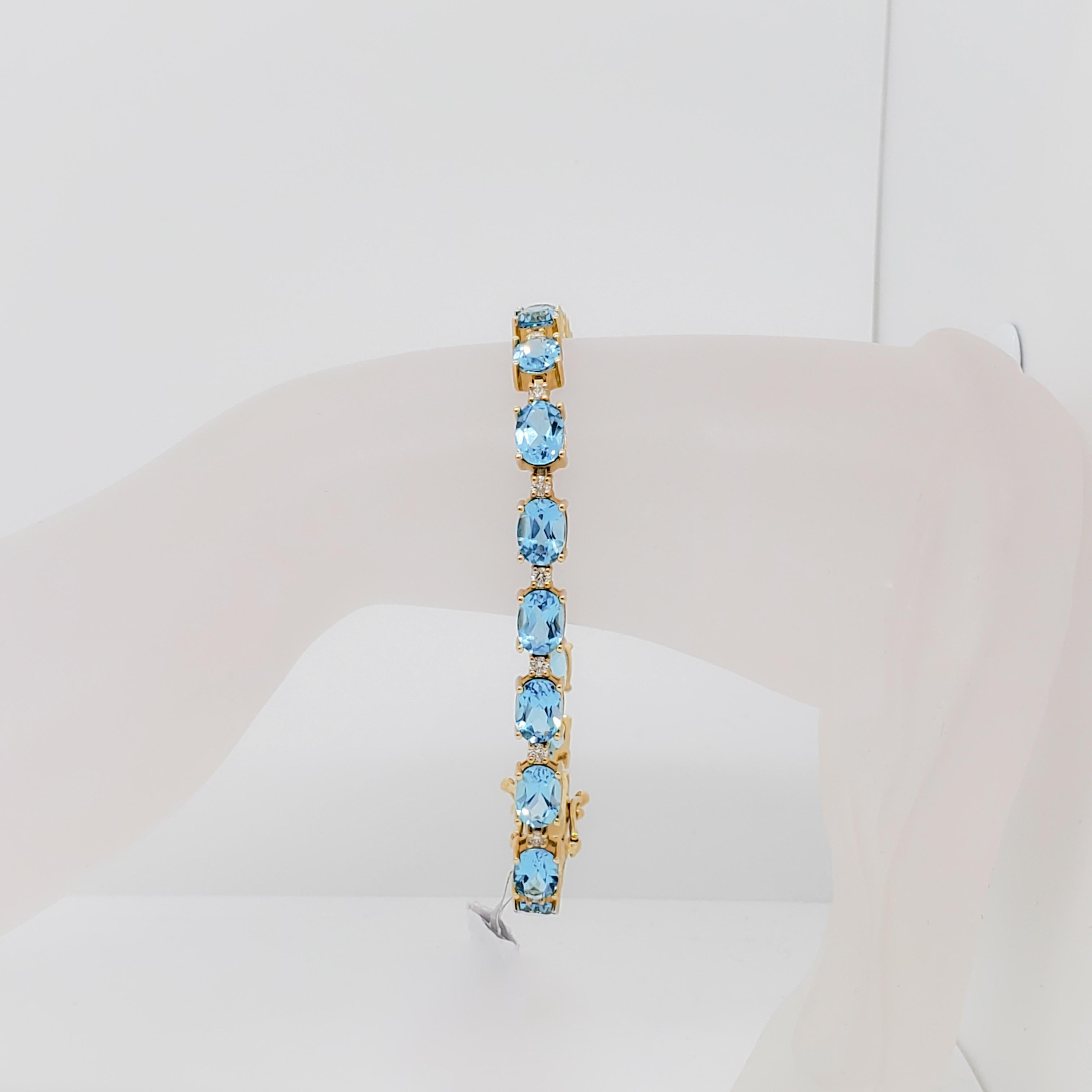 Beautiful bracelet with 17.44 ct. blue topaz ovals and 0.67 ct. white diamond rounds. 19 blue topaz stones and 19 diamonds total. Handmade in 14k yellow gold. Length 7.5