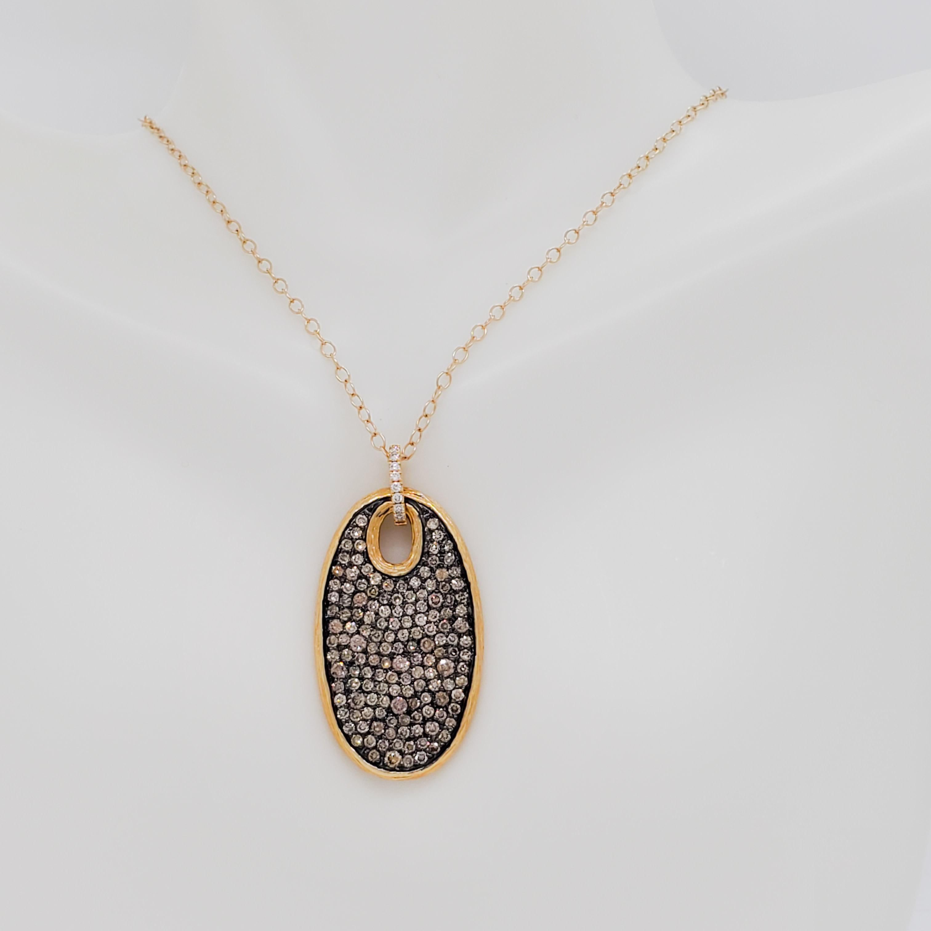 Gorgeous pendant necklace featuring 2.19 ct. champagne and white good quality diamond rounds in a handmade 14k yellow gold mounting.  Length is 16