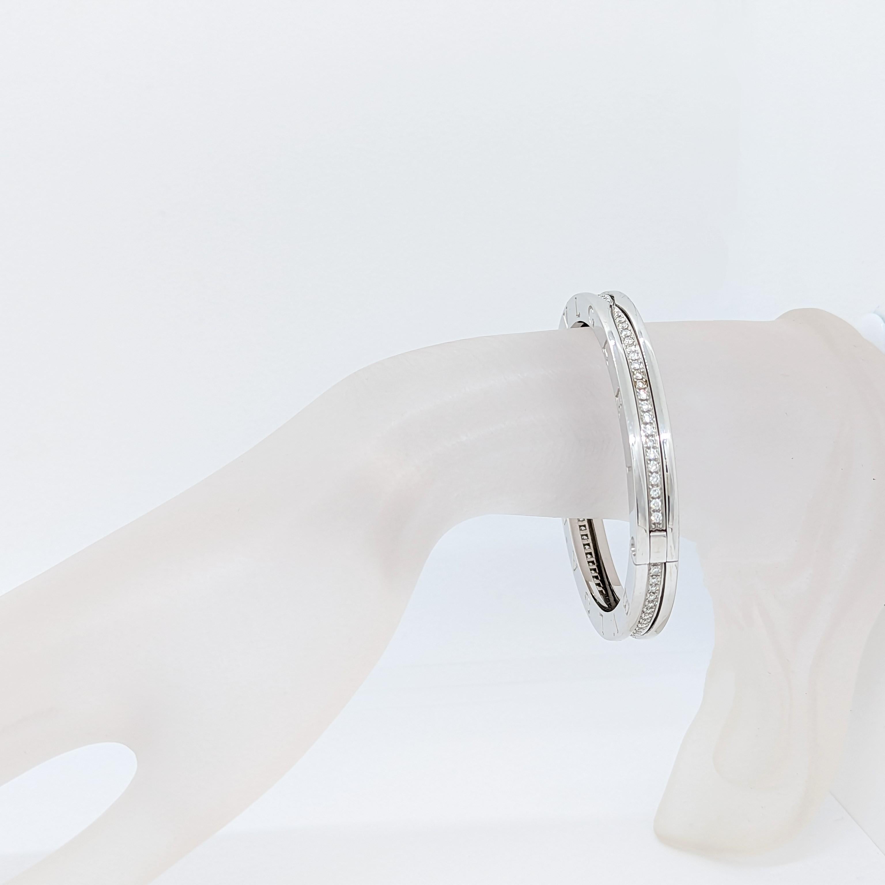 Beautiful estate Bvlgari bangle with good quality white diamond rounds and handmade in 18k white gold. This design is called the B Zero and is part of Bvlgari's classic collection. Current style that is sold in the store.
