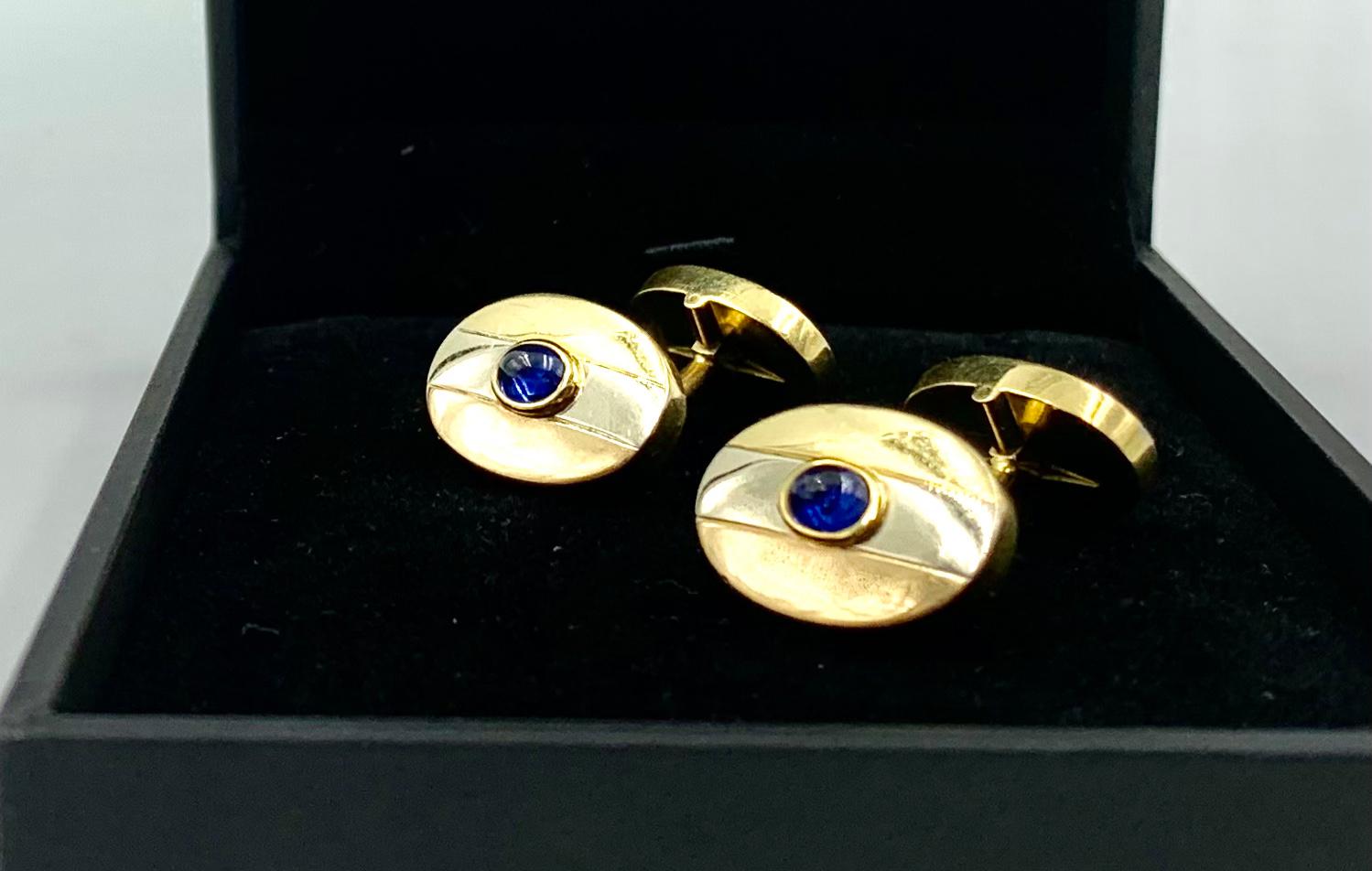 Estate Carlo Weingrill cabochon sapphire and 18k tri-color rose, white and yellow gold cufflinks.
Classic, elegant oval form, substantial size and weight, the backs also tri-color gold and hinged to open in either direction, excellent craftsmanship,
