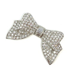 Estate Cartier Diamond and Platinum Bow Pin, Circa 1940's-1950's.