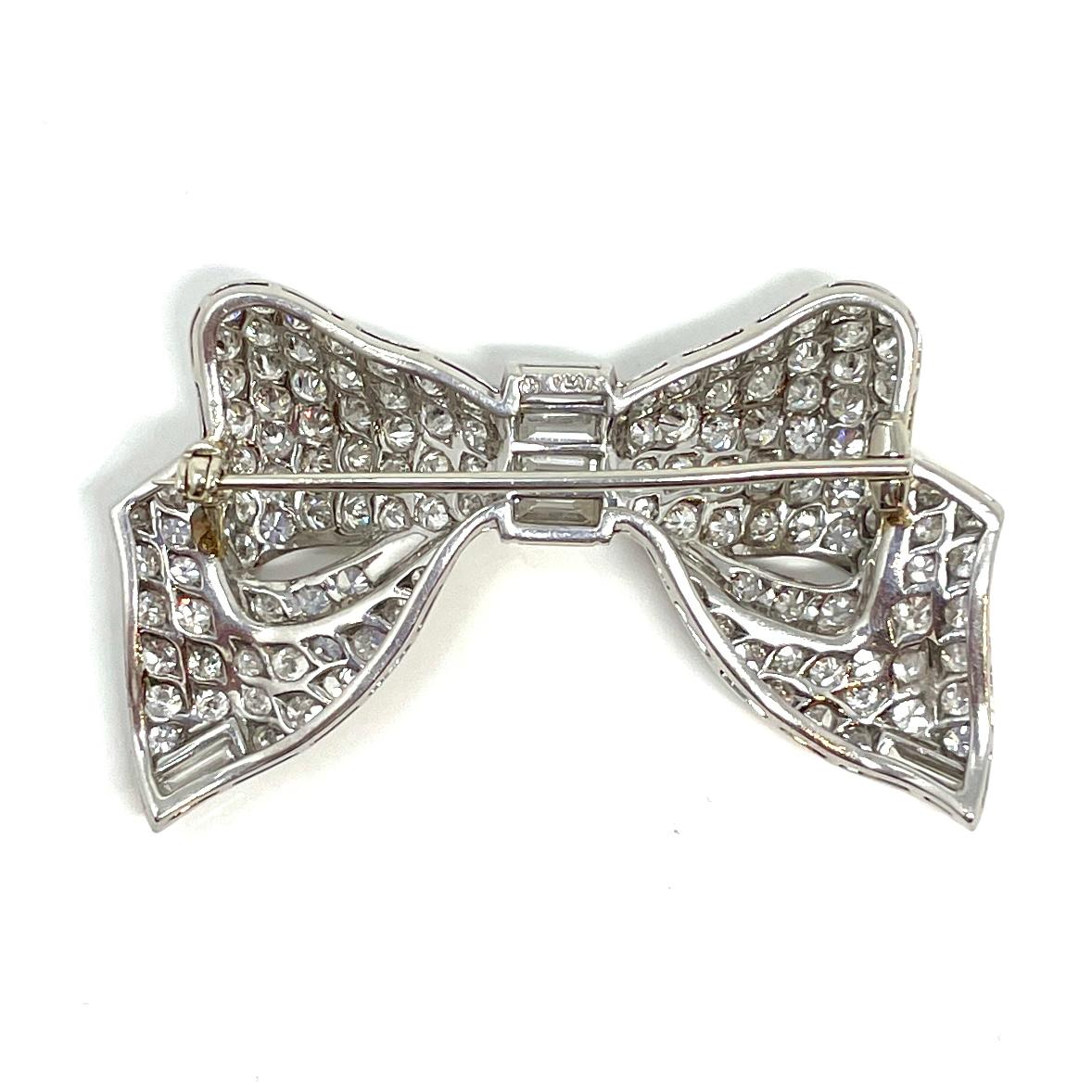 Brilliant Cut Estate Cartier Diamond and Platinum Bow Pin, Circa 1940's-1950's. For Sale
