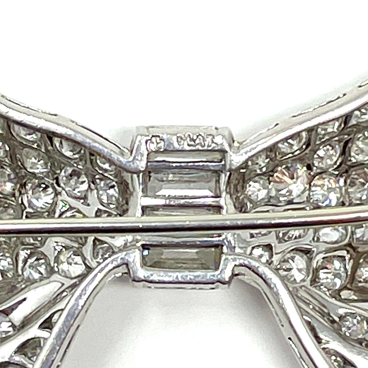 Estate Cartier Diamond and Platinum Bow Pin, Circa 1940's-1950's. In Good Condition For Sale In New Orleans, LA