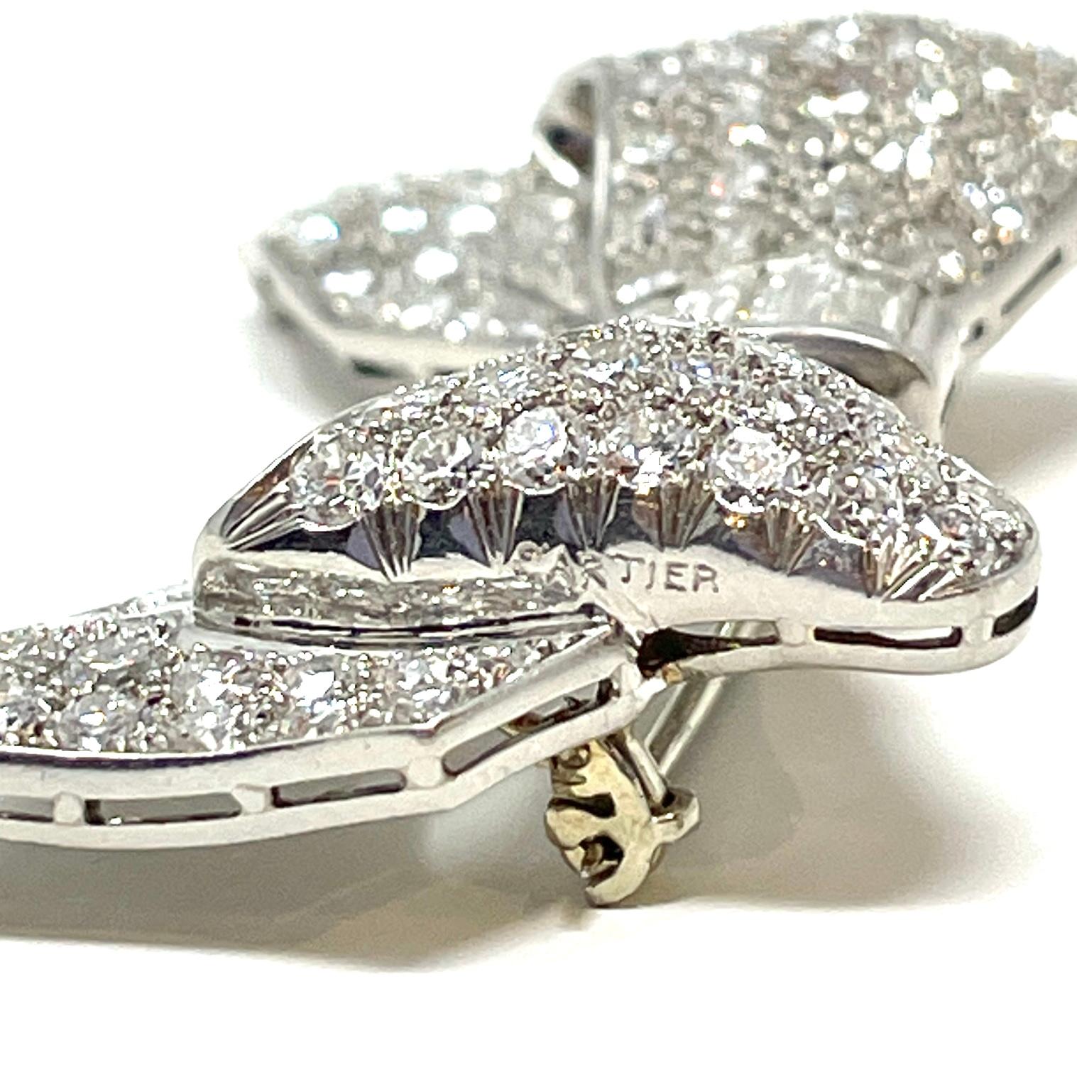 Women's Estate Cartier Diamond and Platinum Bow Pin, Circa 1940's-1950's. For Sale