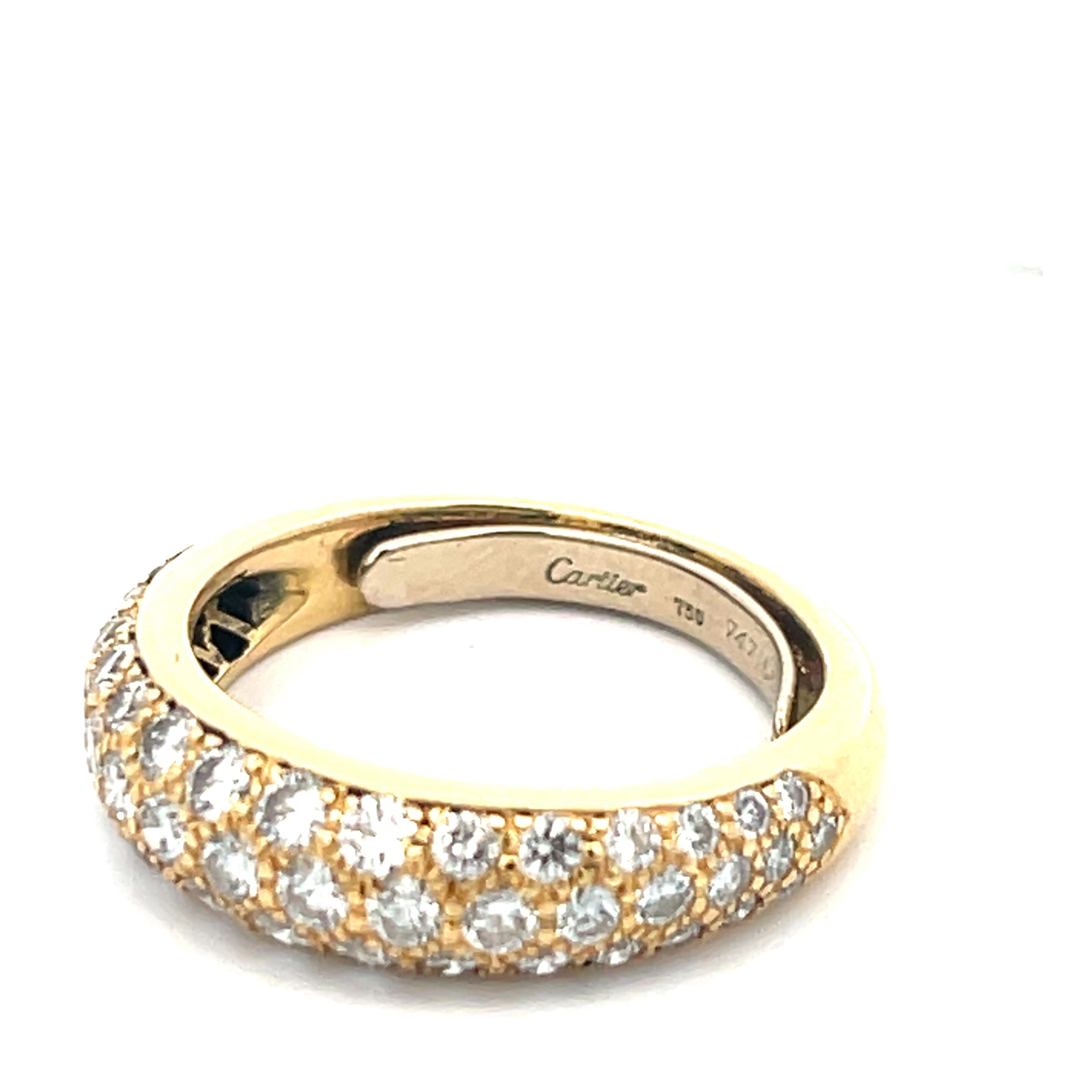Estate Cartier Pave Diamond Band in 18k Yellow Gold. The band features 1.40ctw of brilliant round cut diamonds. Rind size 5, weighs 4.7 grams, and is 5.25mm wide.