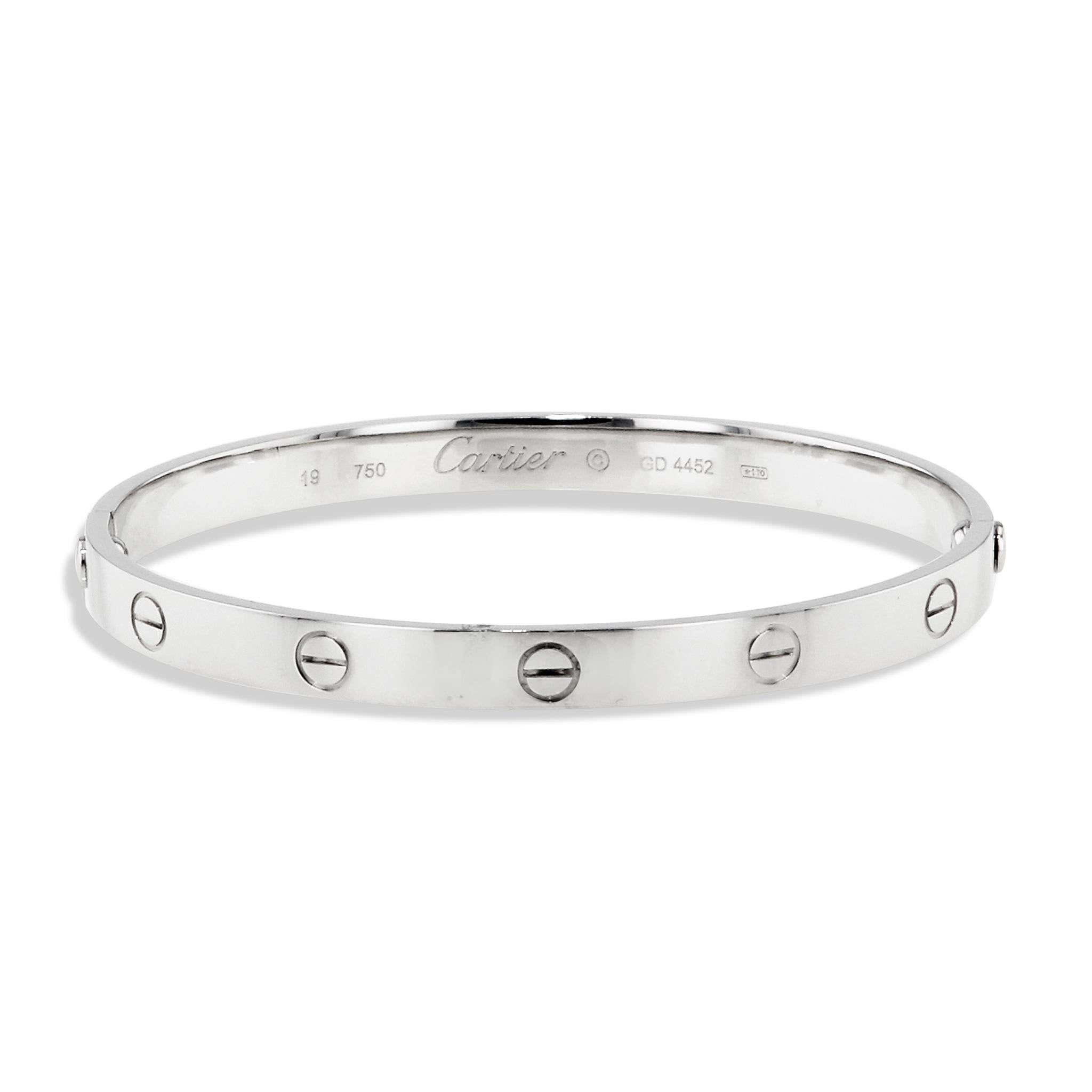 This classic Cartier Love Bracelet is a timeless statement piece. 
Crafted in 18 karat white gold, this estate bracelet is engraved with the iconic Cartier logo and GO 4452. 
The size 19 bracelet's classic design ensures it will never go out of