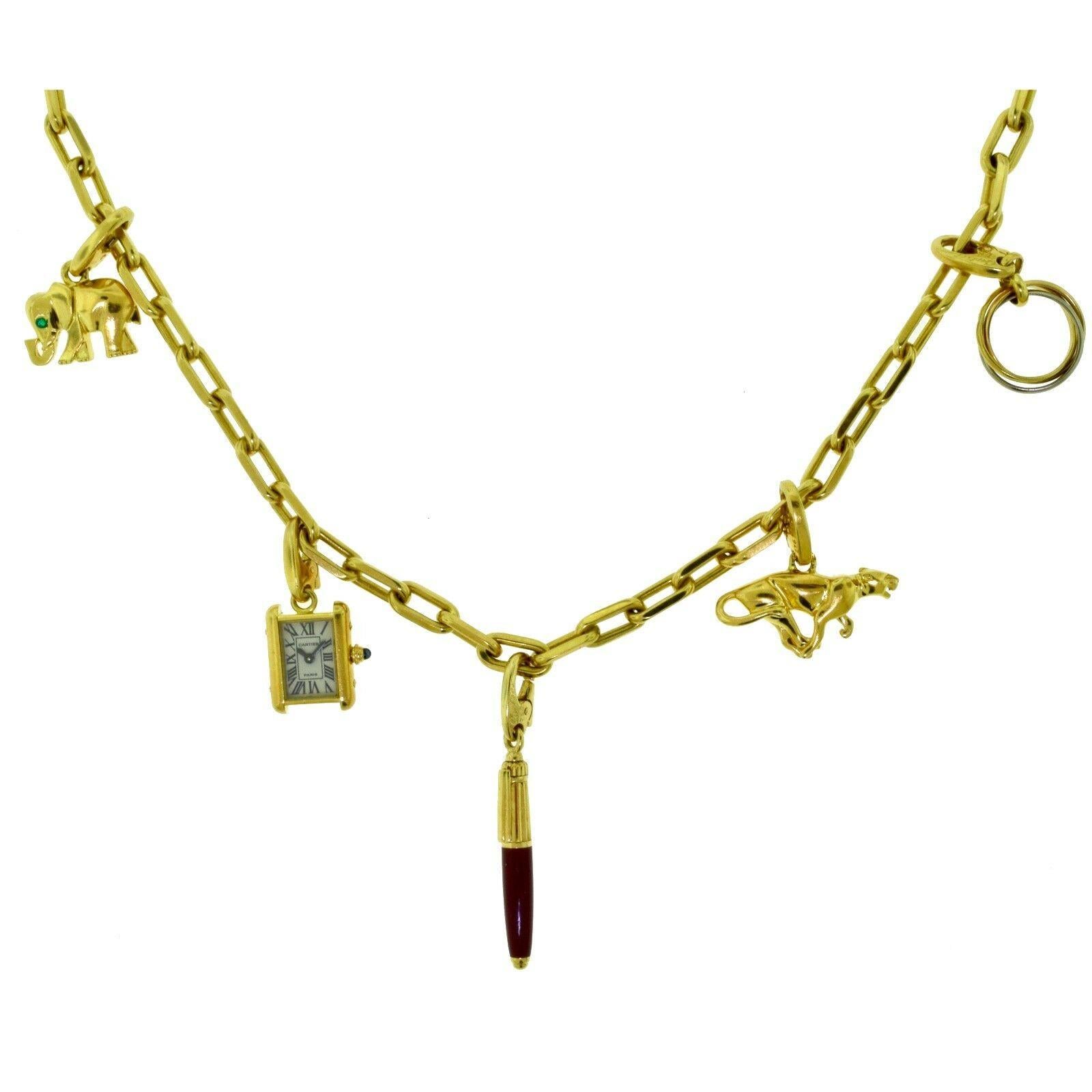 Brilliance Jewels, Miami
Questions? Call Us Anytime!
786,482,8100

Instantly recognizable Cartier charms on a gorgeous Yellow Gold Cartier Santos Chain. Charms are an elephant with emerald eye, Cartier Tank Francaise Watch, burgundy Pen, Running