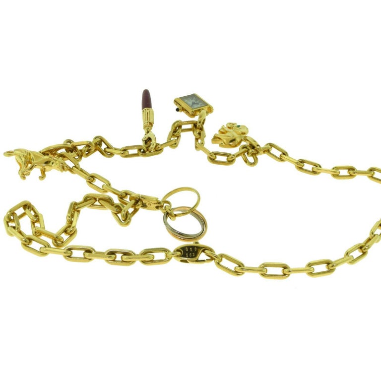 Estate Cartier Yellow Gold Santos Necklace with Set of Cartier Charms at 1stDibs