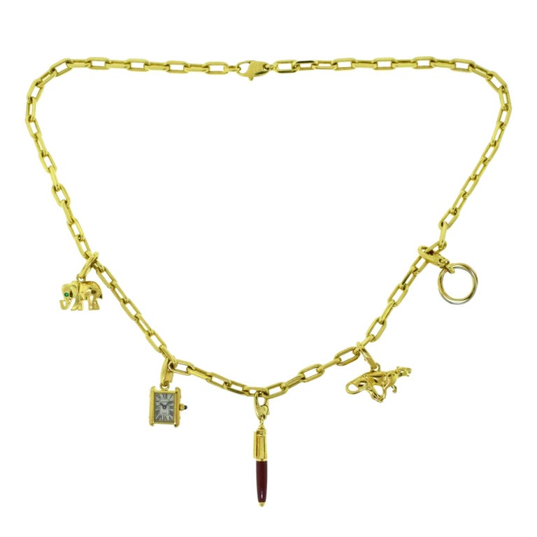Estate Cartier Yellow Gold Santos Necklace with Set of Cartier Charms at 1stDibs