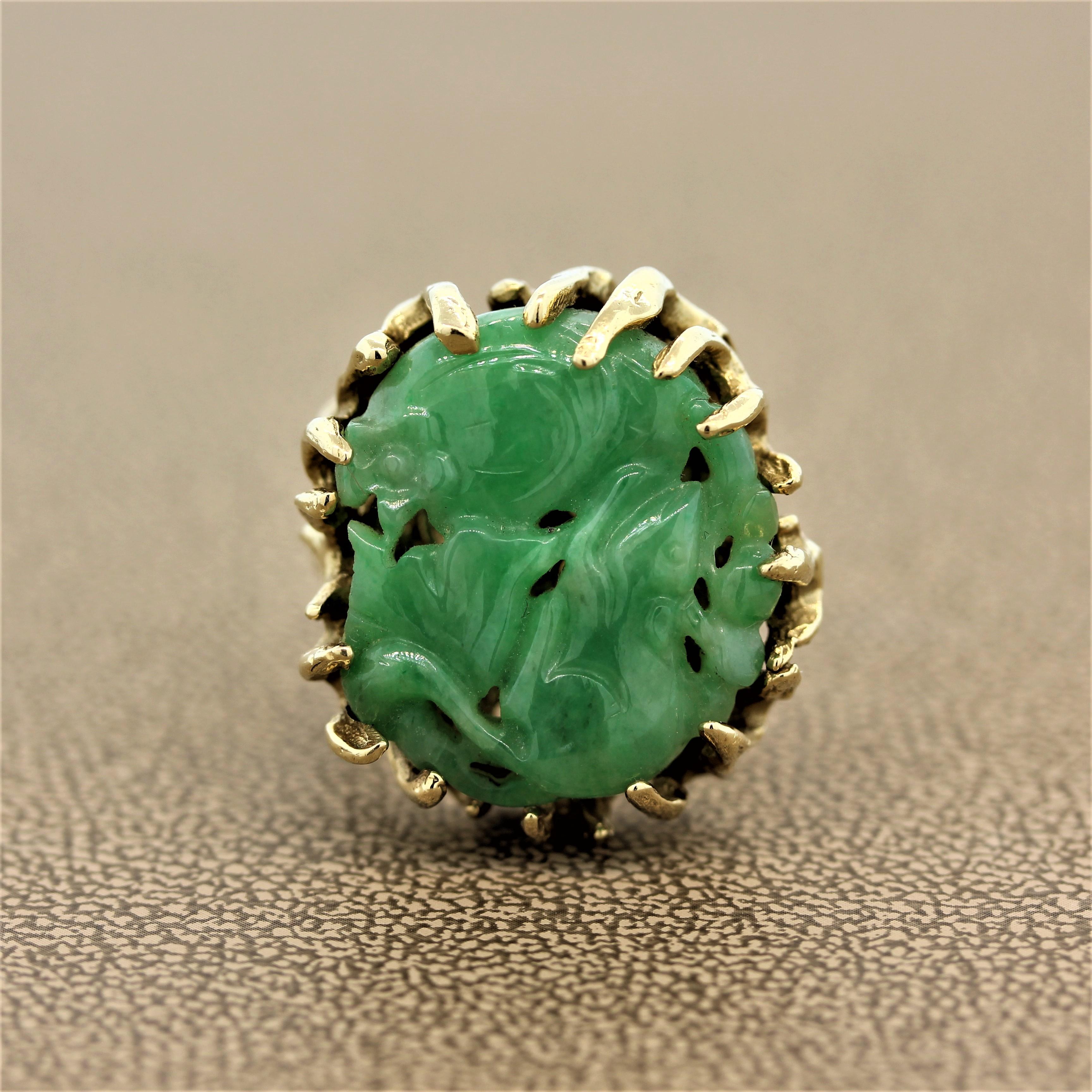 A cocktail ring featuring carved jadeite jade of a mouse playing in flowers. This whimsical jade is set in a carved 14K yellow gold shank to resemble a tree branch in keeping with its garden motif.   

Ring Size 6.25 (Sizable)
