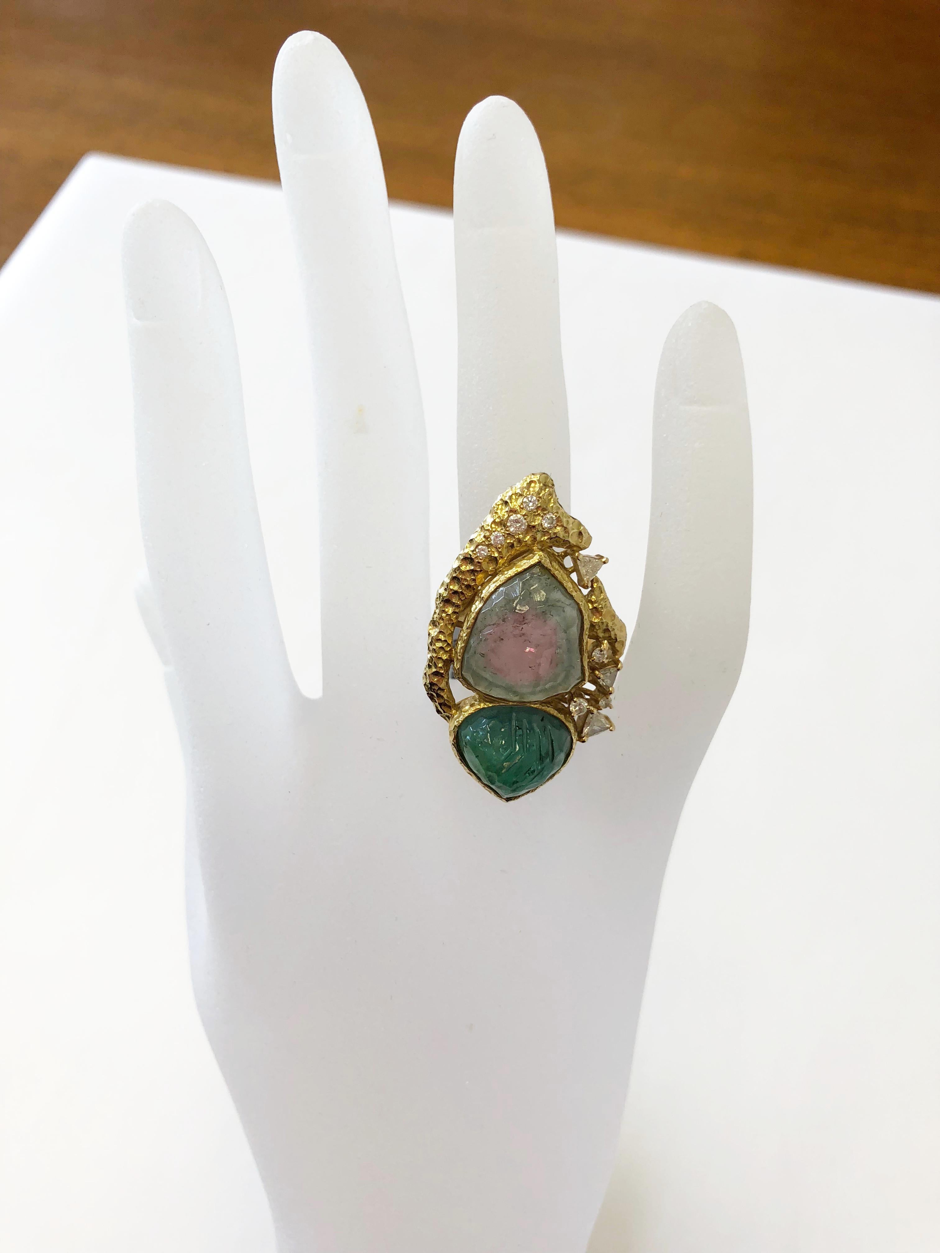 Stunning 14.22 carat carved watermelon tourmaline with carved emerald and 0.37 carats of white diamond trillion and round.  This beautiful estate ring has been handcrafted in 18k yellow gold and is a size 6.75.  Ideal for someone who appreciates the
