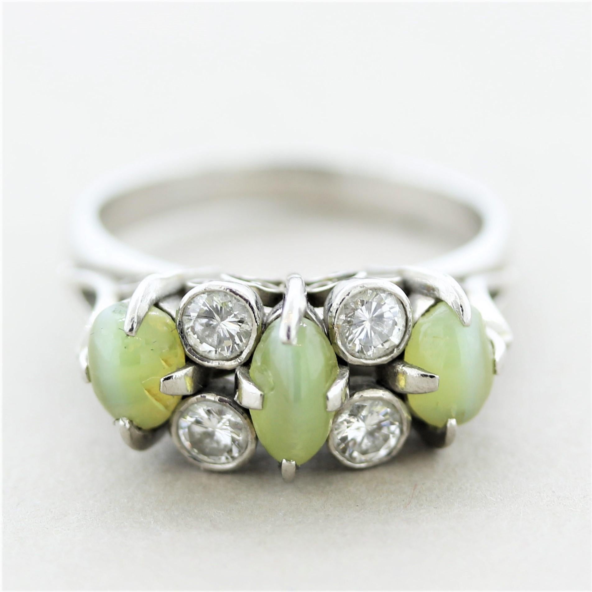 A unique and stylish ring, circa 1960’s, featuring 3 cats eye chrysoberyls and 4 round brilliant-cut diamonds. Hand-fabricated in platinum and ready to be worn.

Ring Size 6.75