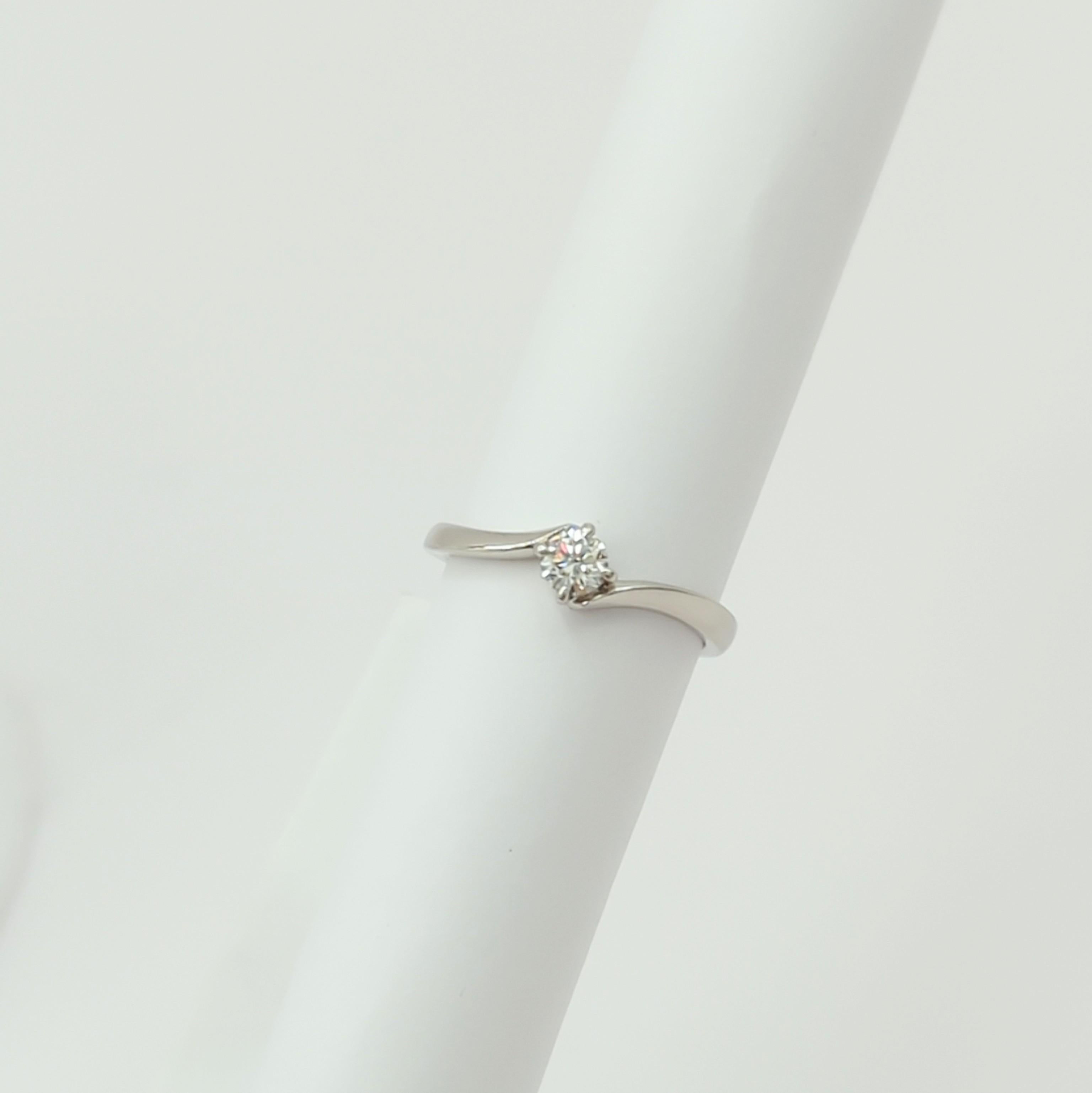 Women's or Men's Estate Celine White Diamond Solitaire Ring in Platinum  For Sale