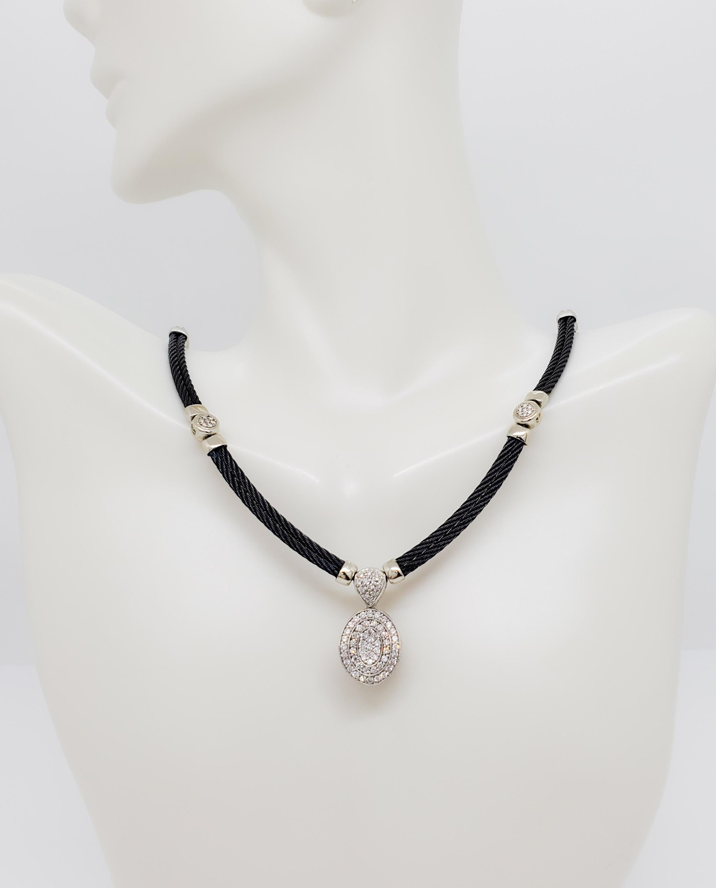 Beautiful estate Charriol necklace.  Good quality white diamond rounds on a black steel cable necklace.  18k white gold.