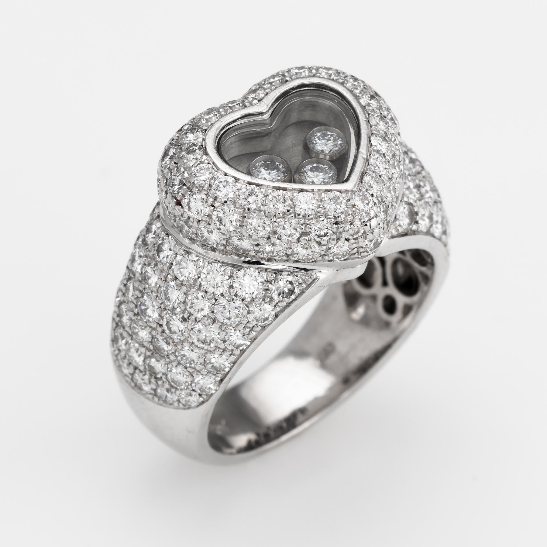 Finely detailed pre owned Chopard diamond heart ring, crafted in 18 karat white gold. 

Round brilliant cut diamonds are pave set into the heart and shoulders totaling an estimated 3 carats. Three estimated 0.05 carat diamonds 'float' inside the