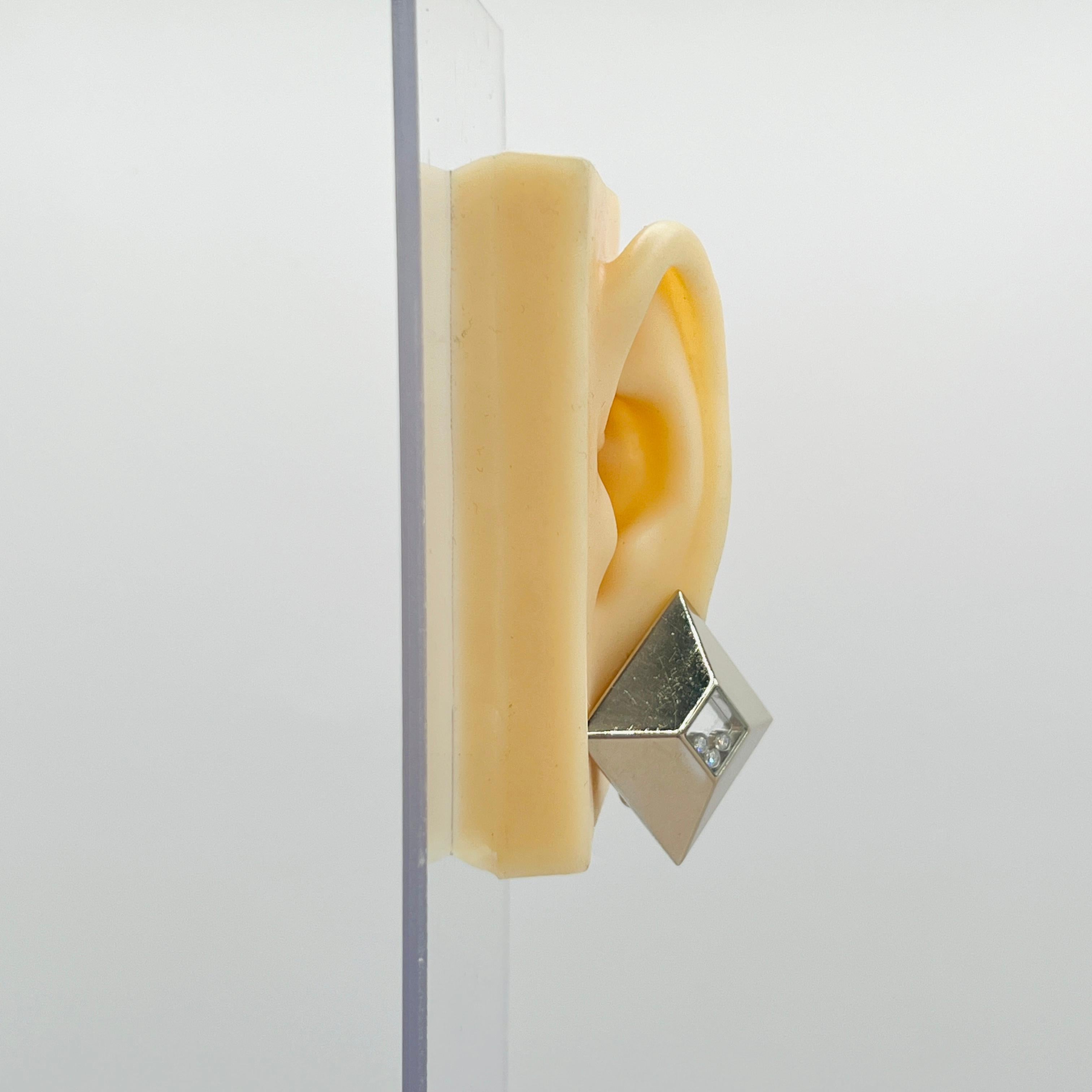 Beautiful estate Chopard earring, ring and pendant set with floating white diamond rounds.  