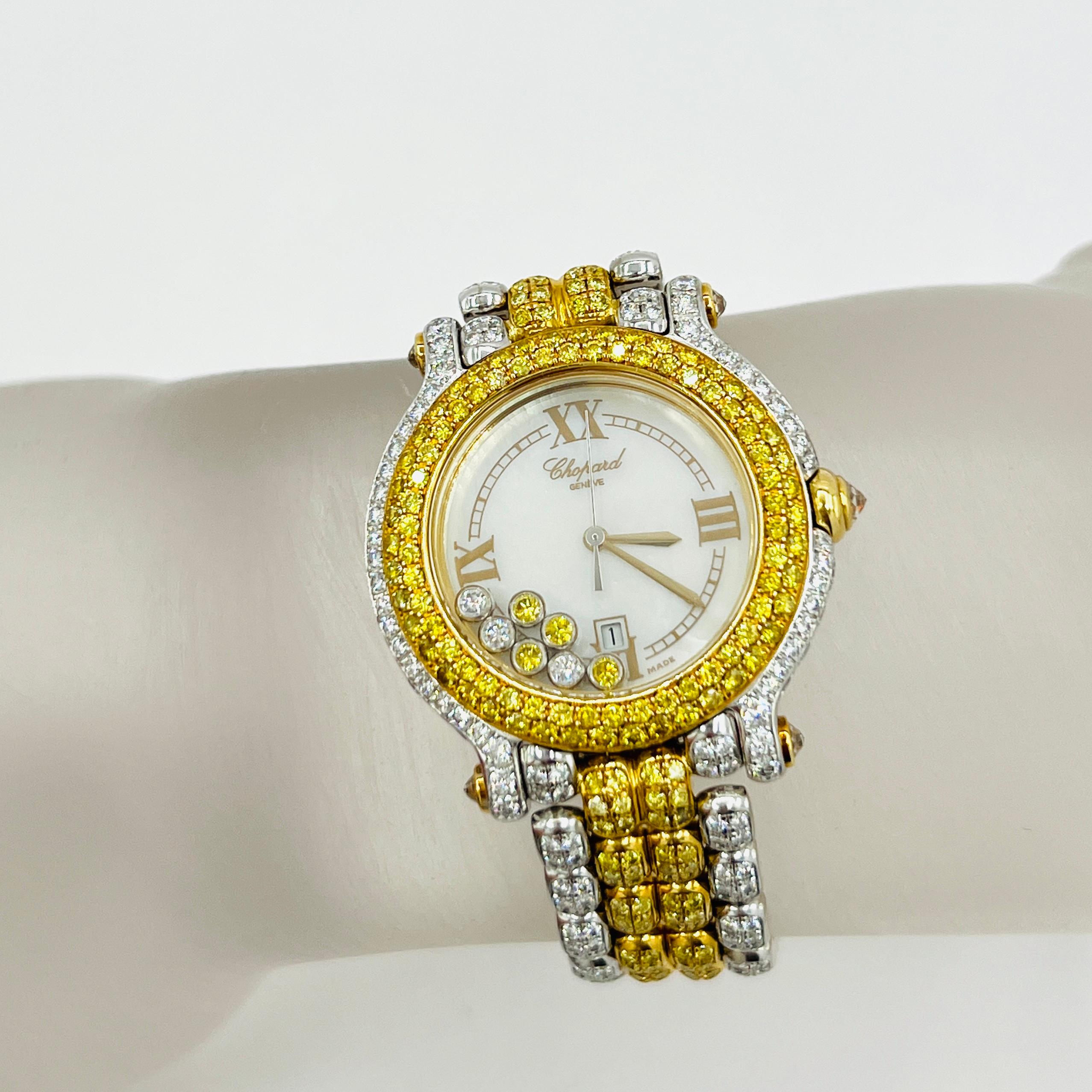 Absolut atemberaubend Nachlass Chopard Happy Sport 18k zwei Ton Damenuhr mit weißen und gelben Diamanten.  Alle natürlichen gelben und weißen Diamanten auf der Uhr mit 7 zusätzlichen Diamanten, die im Zifferblatt schweben.  Handgefertigt aus 18
