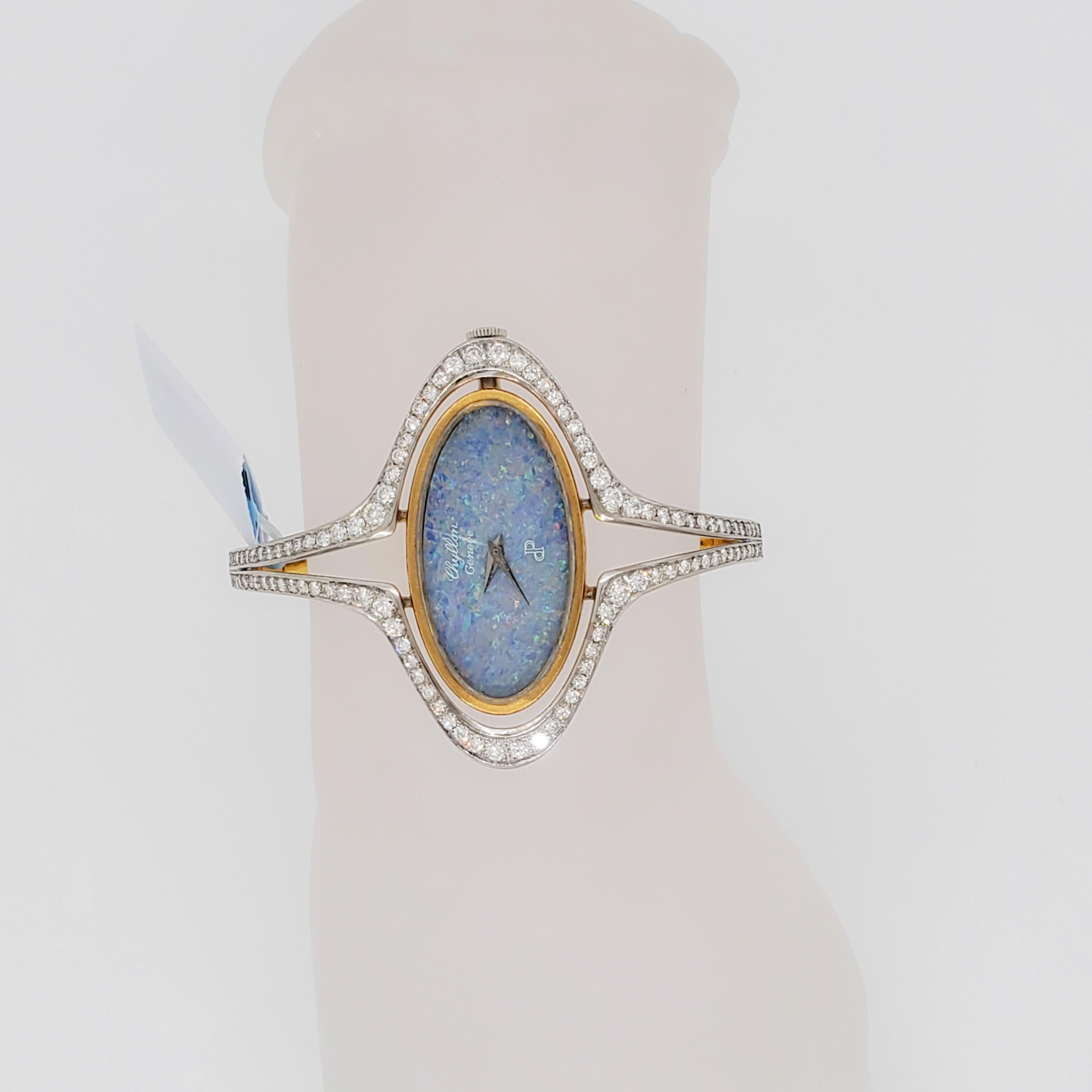 Gorgeous Chyllon Geneve bangle watch featuring opal and white diamonds in 18k white and yellow gold.  