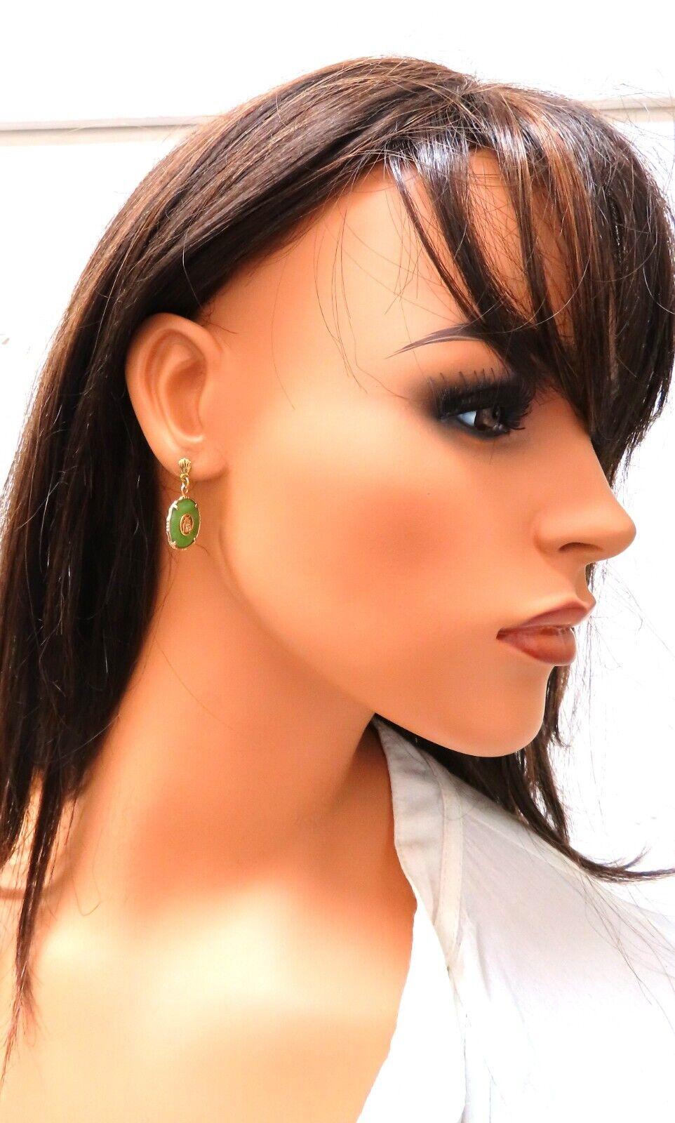  Chinese Jade drop dangle earrings

14mm diameter

14 karat yellow gold 3.8 gram

Earrings measure 1 inch long

Comfortable Butterfly Dangle