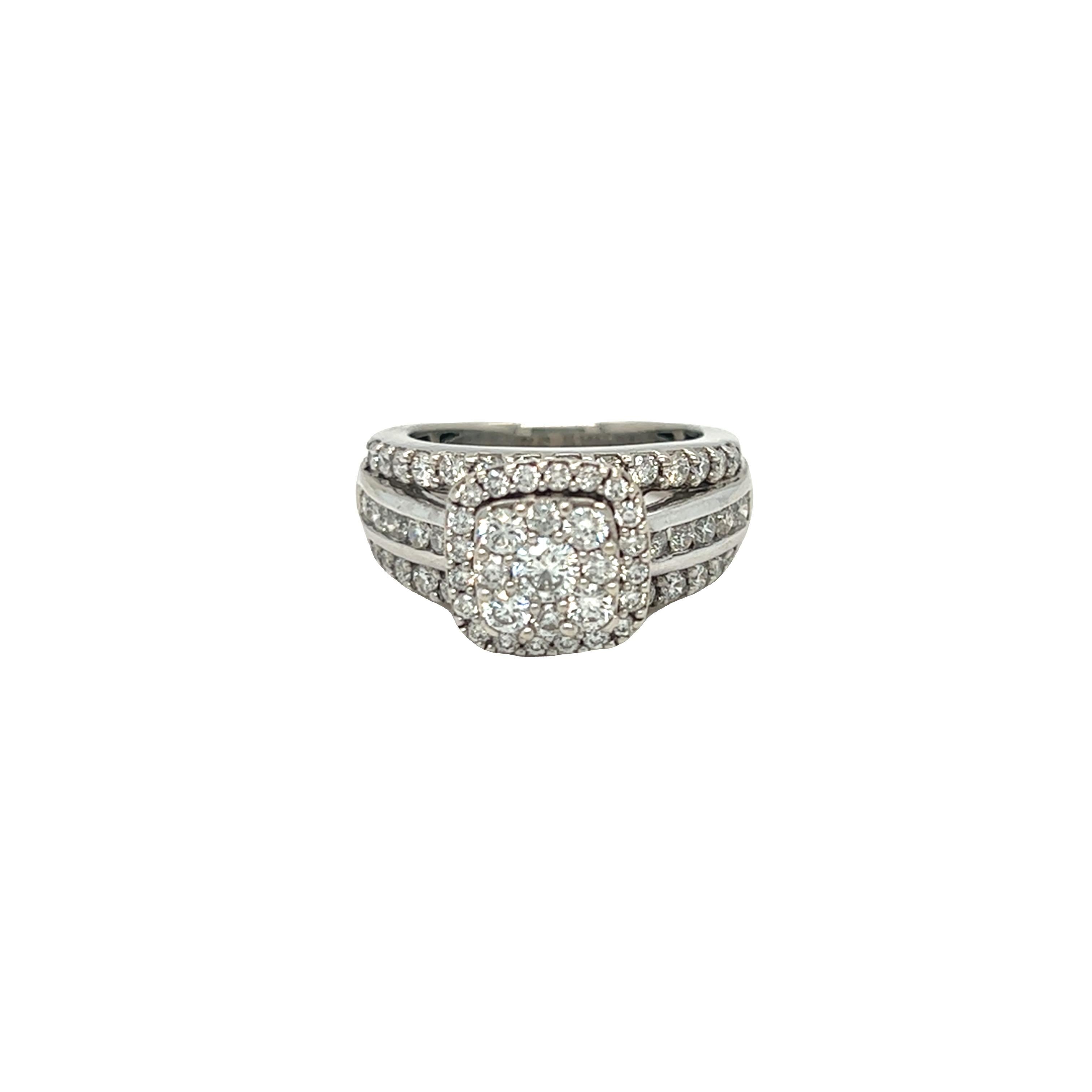 Beautiful clustered diamond engagement ring with round brilliant diamond weighing approximately 2.50 carats in total with quality of H color and SI clarity. The ring is crafted in 14K white gold with wide split shank giving an illusion of stacked