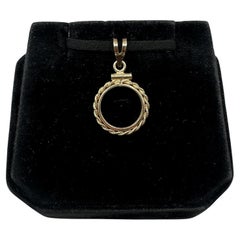 Ciondolo a forma di moneta in oro giallo 14 carati - Diametro interno 13,6 mm, peso 1,3 grammi