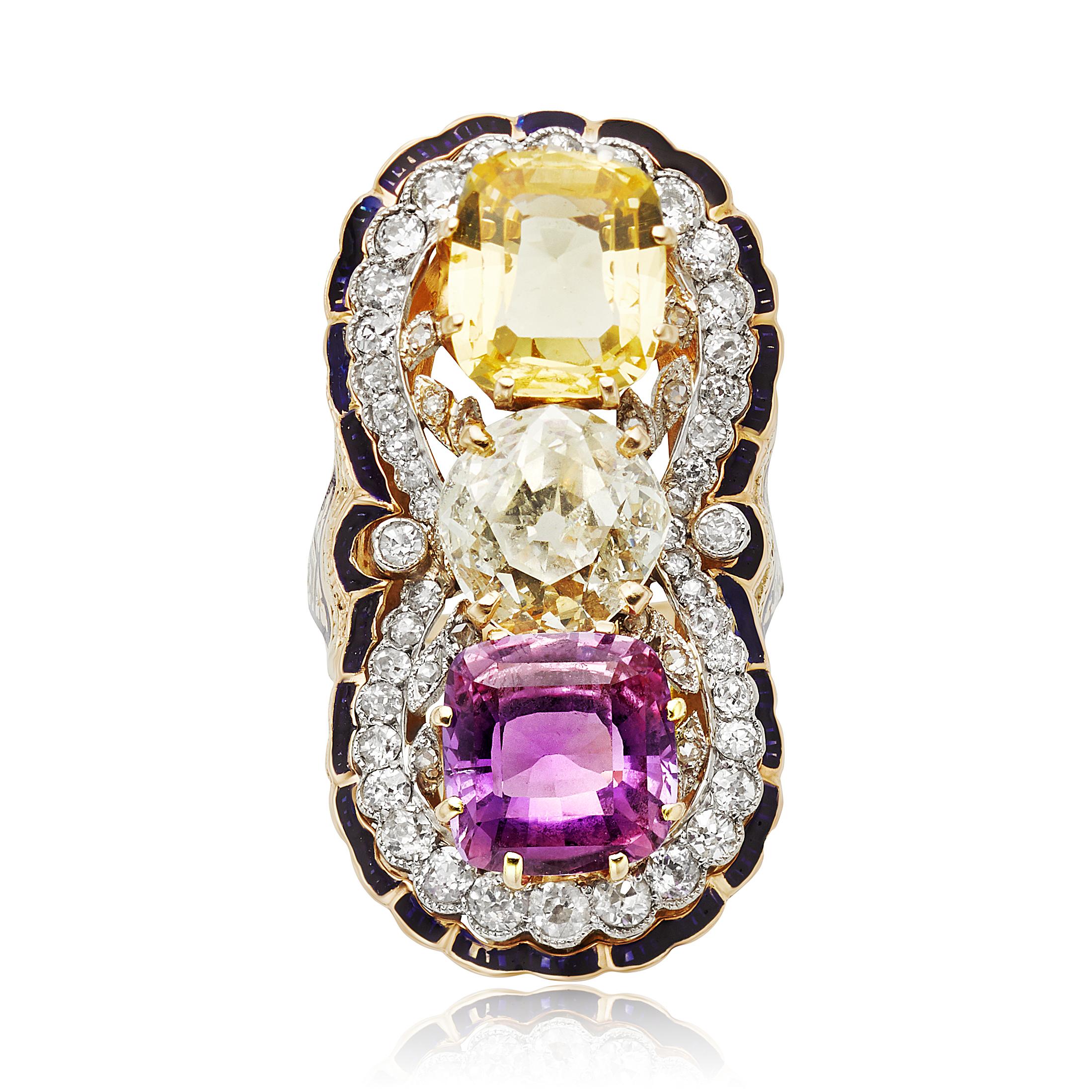 This ring is centered with a Old Mine Cut diamond that weighs approximately 1.88 carats with O color and VS2 clarity.  The ring is accented with a pink sapphire and a golden sapphire.  These two sapphires have an approximate combined weight of 7.87