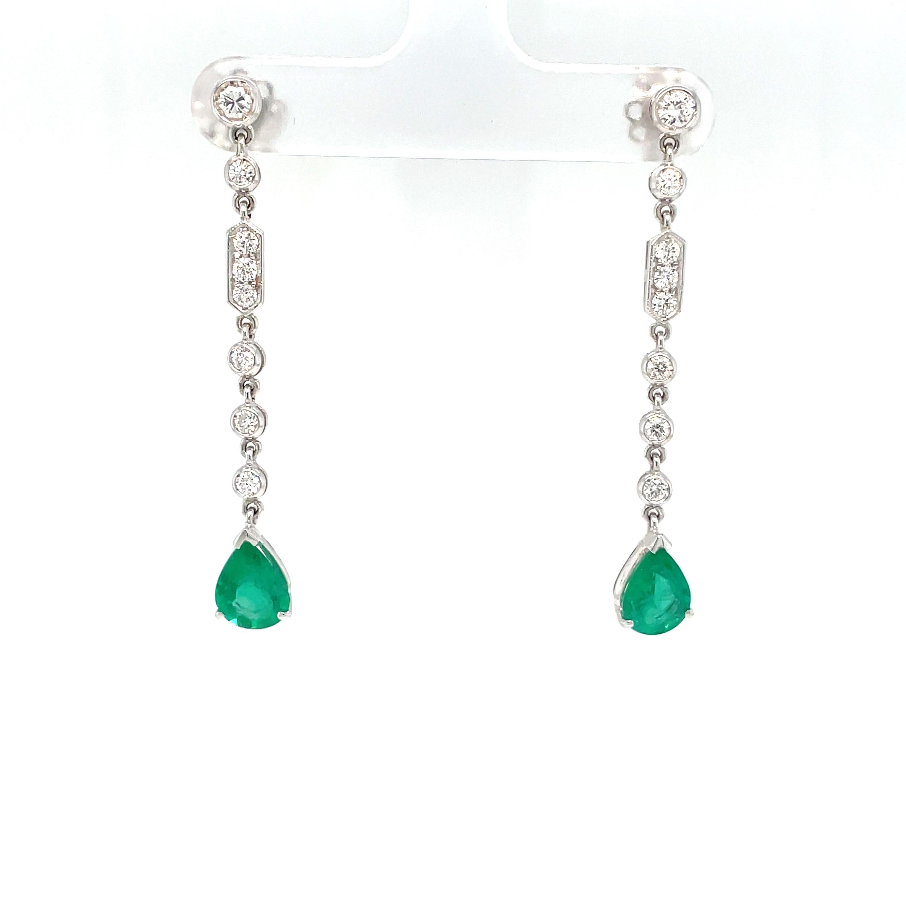 Beautiful and elegant Italian Estate 18k white gold earrings

They feature at the bottom 2 large Pear shaped Natural Colombian Emeralds, weighing 1.10 carat each, connected by links, inspired by Art Deco design, set with colorless round Diamonds