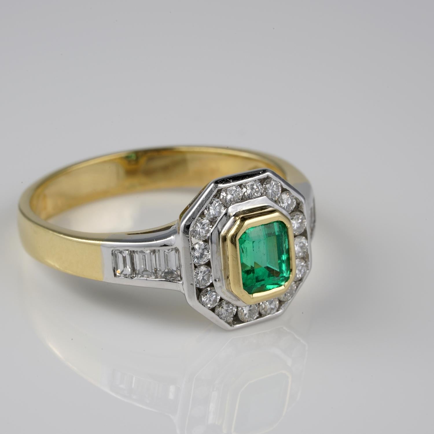 This timeless Estate ring has been skilfully hand made of solid 18 KT gold, white & yellow – marked with Italian assay and maker number
Charming octagonal crown with the Emerald as main point richly surrounded by Diamonds set in frame and baguette