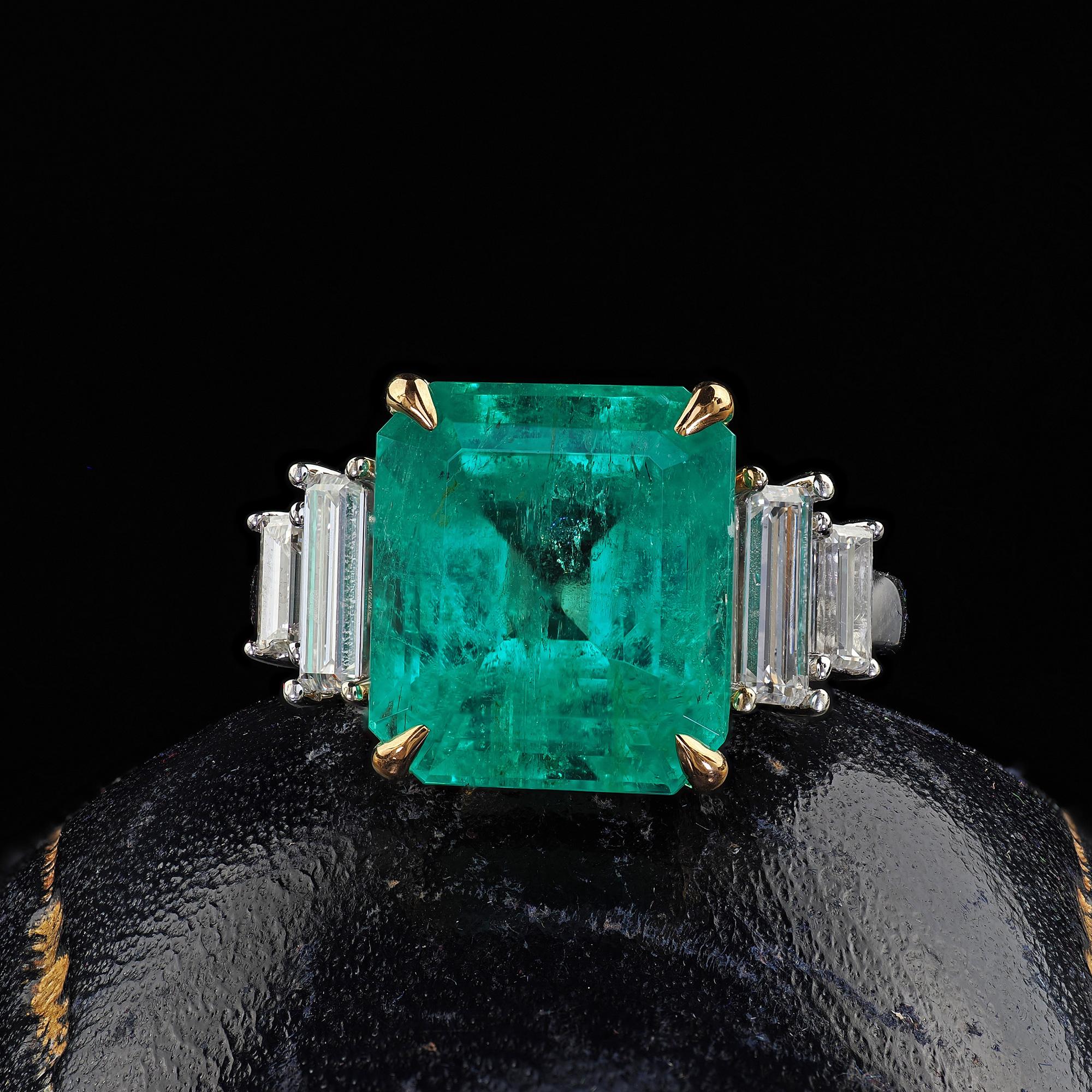 Beautiful Estate Contemporary 14K White Gold Colombian Emerald Diamond Cocktail Ring - GIA. This gorgeous estate Colombian emerald and diamond ring is crafted in 14k white gold. This ring features a glowing green Colombian emerald in the center and