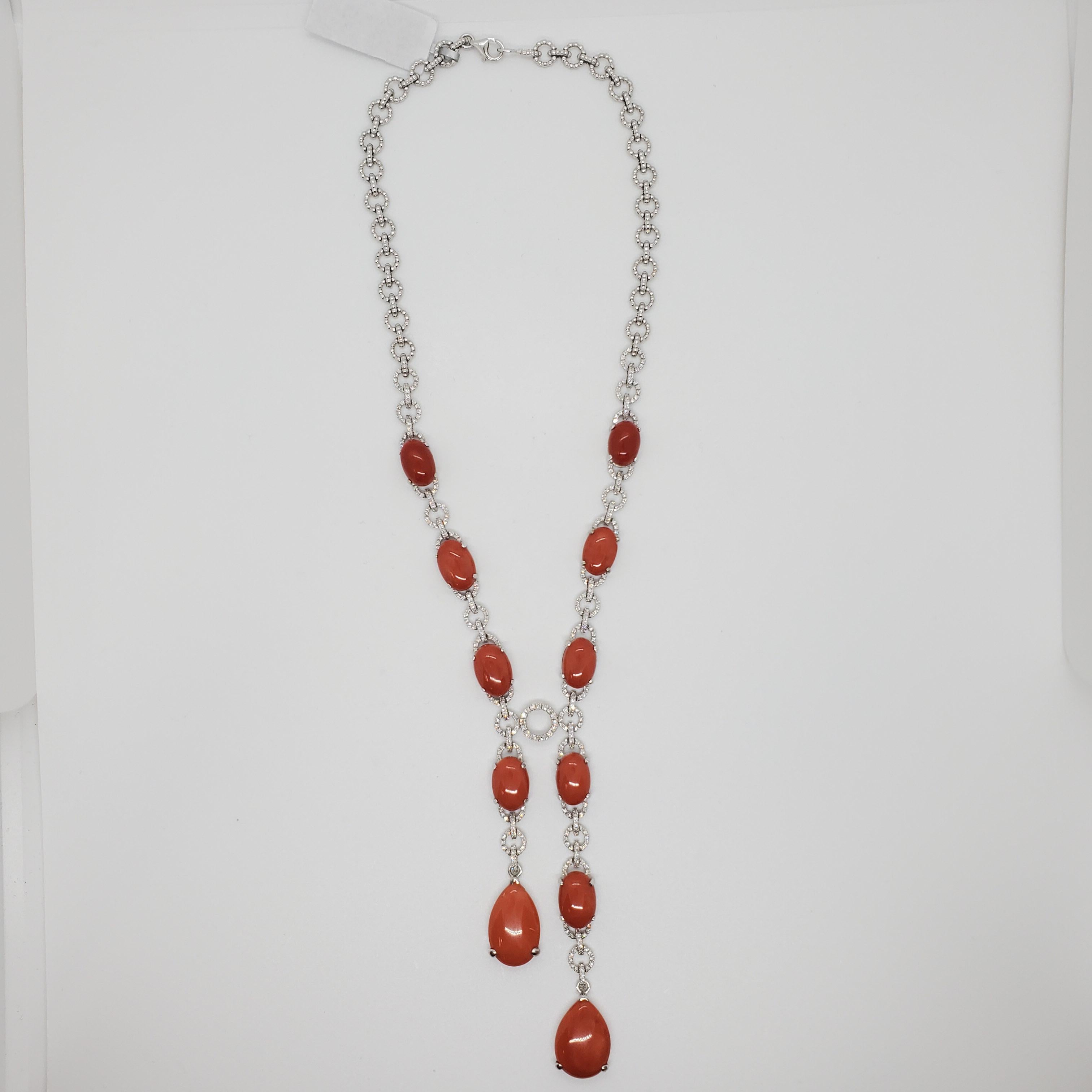 Gorgeous coral set featuring 22 good quality corals with 4.95 ct. of good quality, white, and bright diamond rounds. There are a total of 844 diamond rounds in this set. Well made and very versatile since pieces can be worn together or separately in