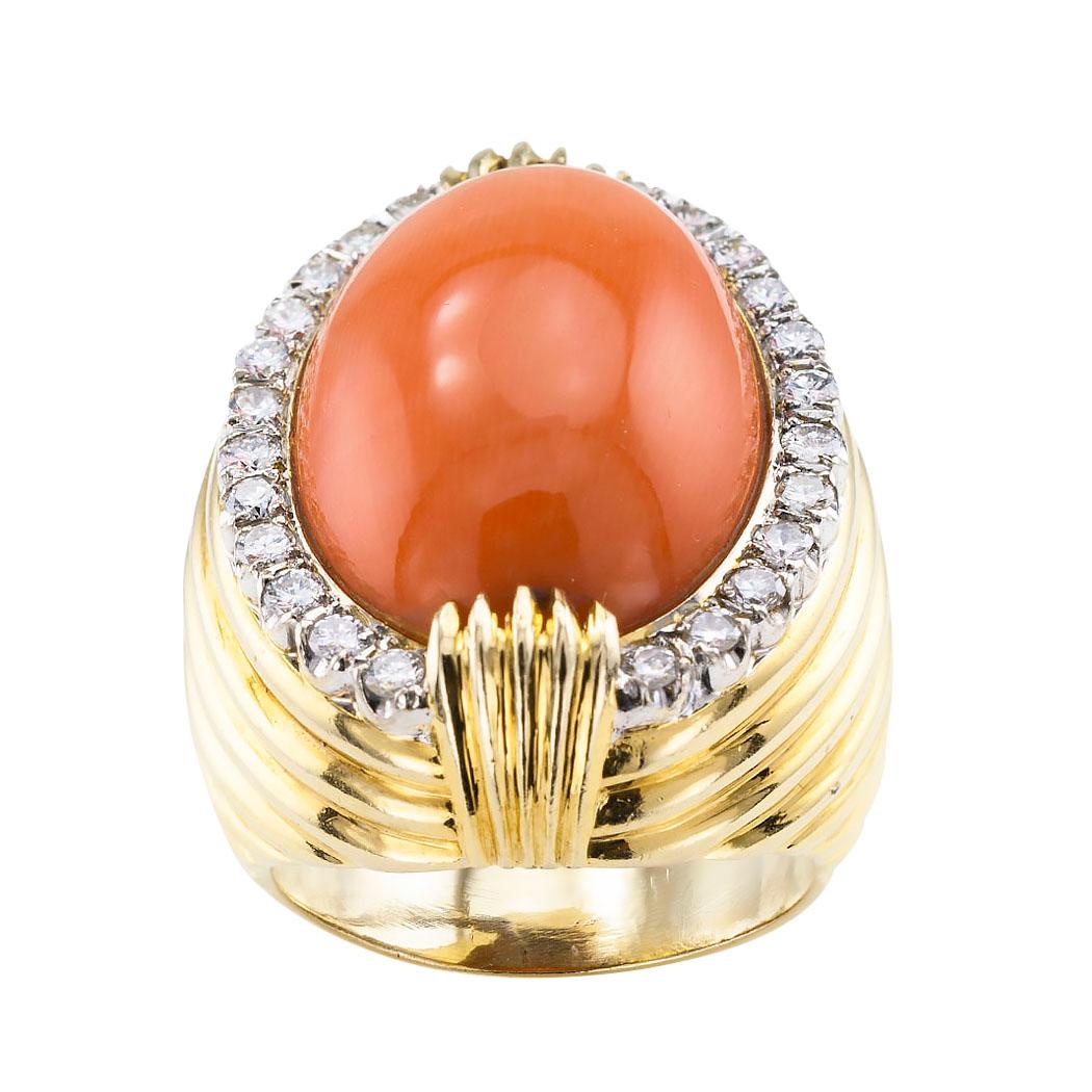 Estate coral diamond and yellow gold cocktail ring circa 1980.

DETAILS:

GEMSTONES:  one oval coral measuring approximately 15 X 20 mm.

DIAMONDS:  twenty-four round brilliant-cut diamonds totaling approximately 0.75 carat, approximately H color,