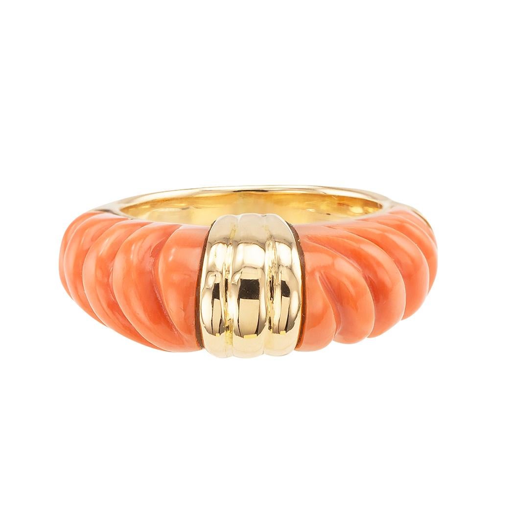 Estate coral and gold ring band circa 1980.

DETAILS:

METAL:  18-karat yellow gold.

MATERIALS:  coral.

MEASUREMENTS:  approximately 11/16” (1.70 cm) diameter.

RING SIZE:  approximately 4 ¾.

CONDITION:  high magnification photographs show design