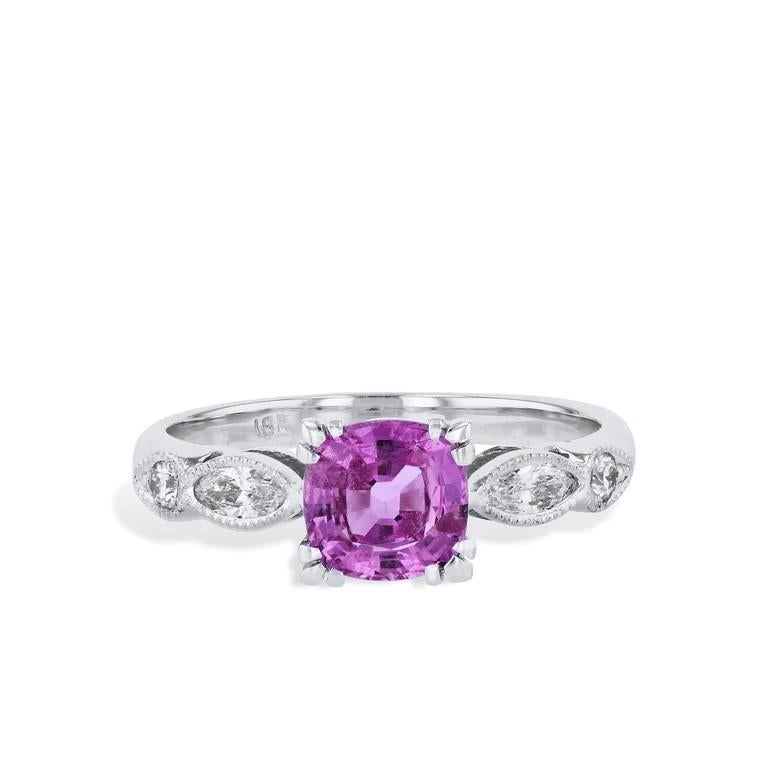 Dazzle with this magnificent 18 karat White Gold Milgrain Estate Ring! 

Boasting a cushion-cut pink sapphire, accompanied by diamonds on each side, you'll be sure to shine!

Size 5.5.

Cushion Cut Pink Sapphire and Diamond Ring

-Pink Sapphire: