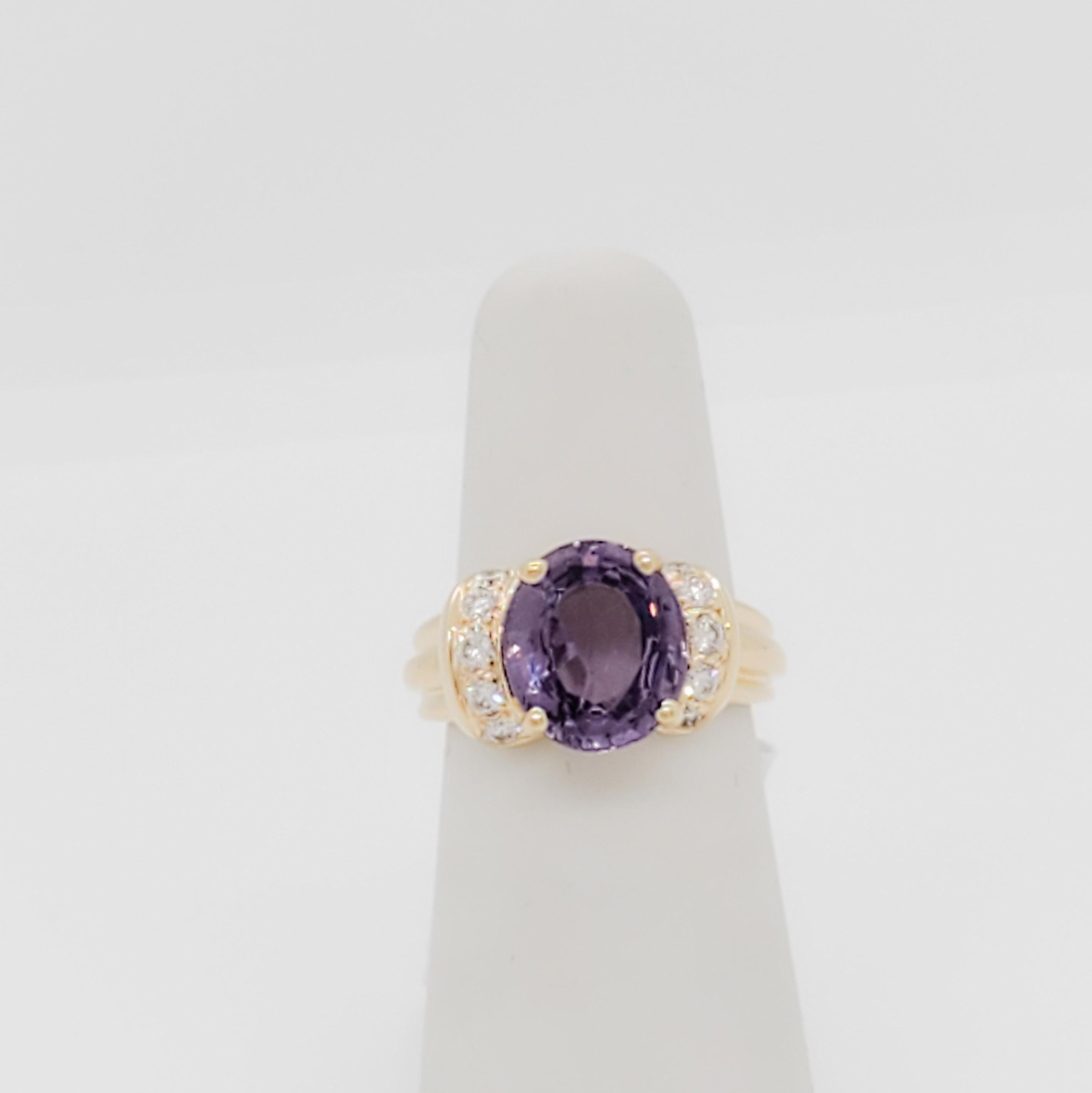 Gorgeous 3.28 ct. purple sapphire oval with 0.10 ct. white diamond rounds.  Handmade in 14k yellow gold.  Ring size 3.75.