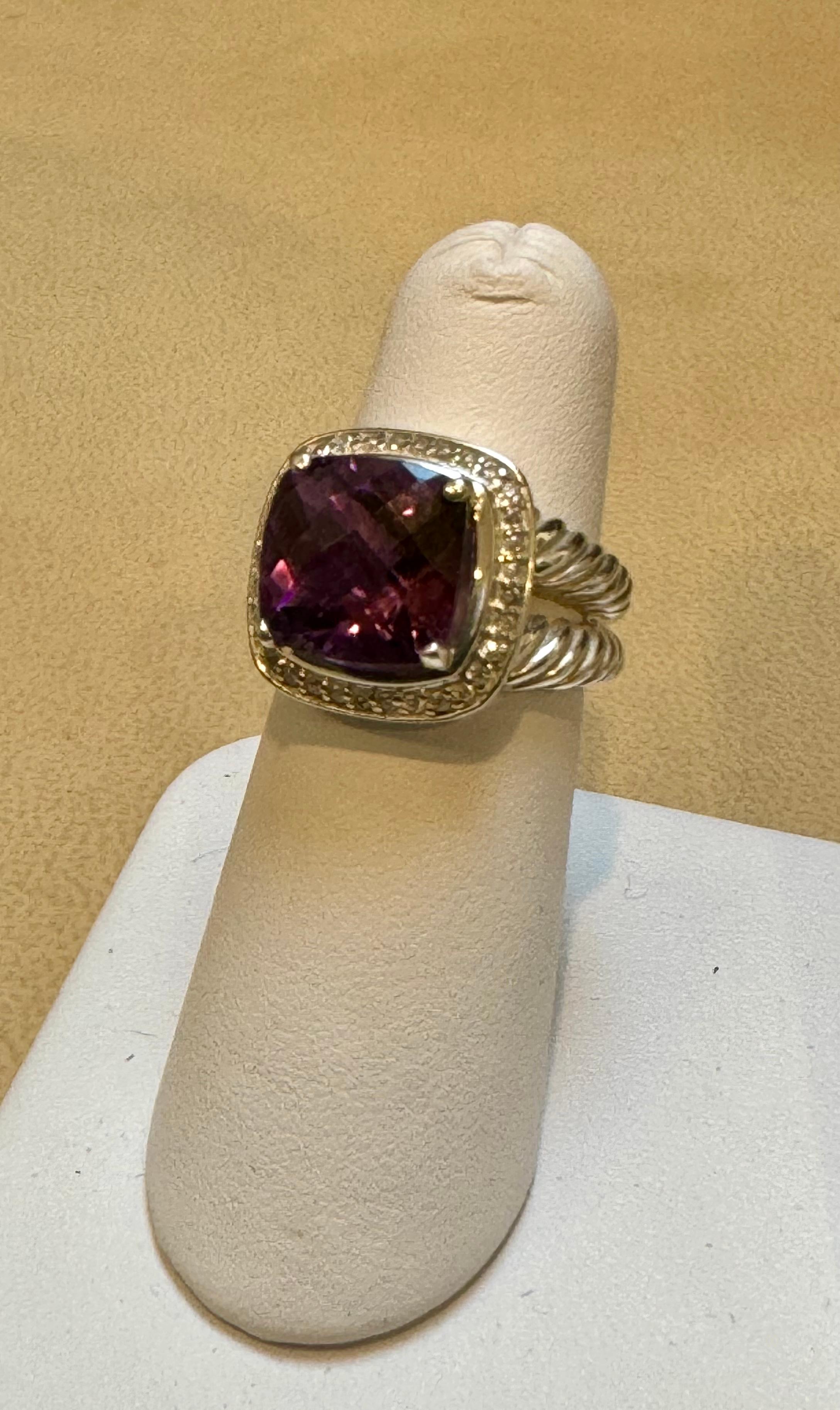 An estate David Yurman Amethyst ring with diamond accents.
Sterling silver 
This beautiful authentic ring is by David Yurman from the his Collection. Crafted from sterling silver featuring split cable shank with smooth polished cushion shape bridge,